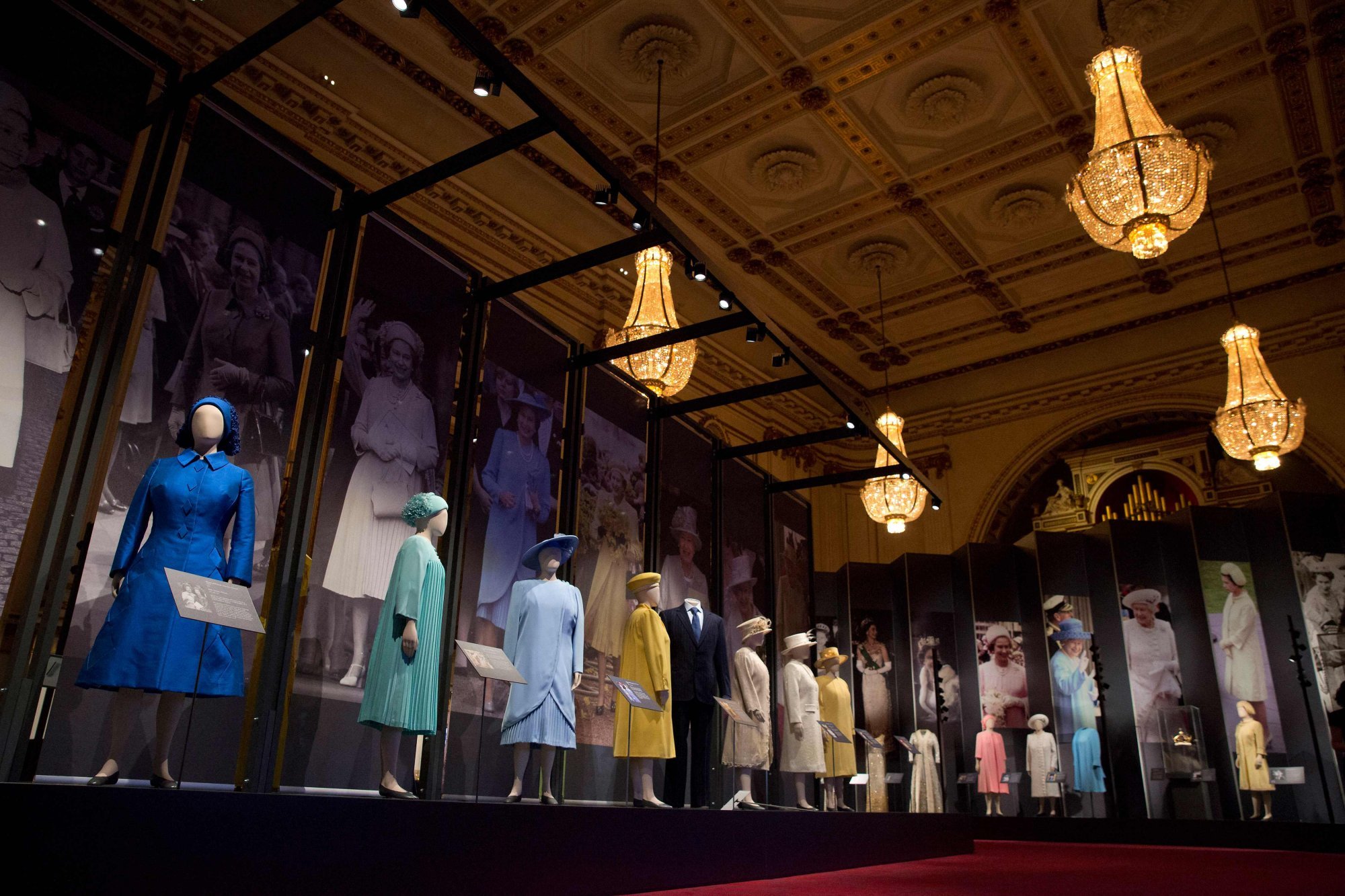 Royal outfits on display at the “Fashioning a Reign: 90 Years of Style from The Queen’s Wardrobe” exhibition at Buckingham Palace in London in 2016. Photo: AFP