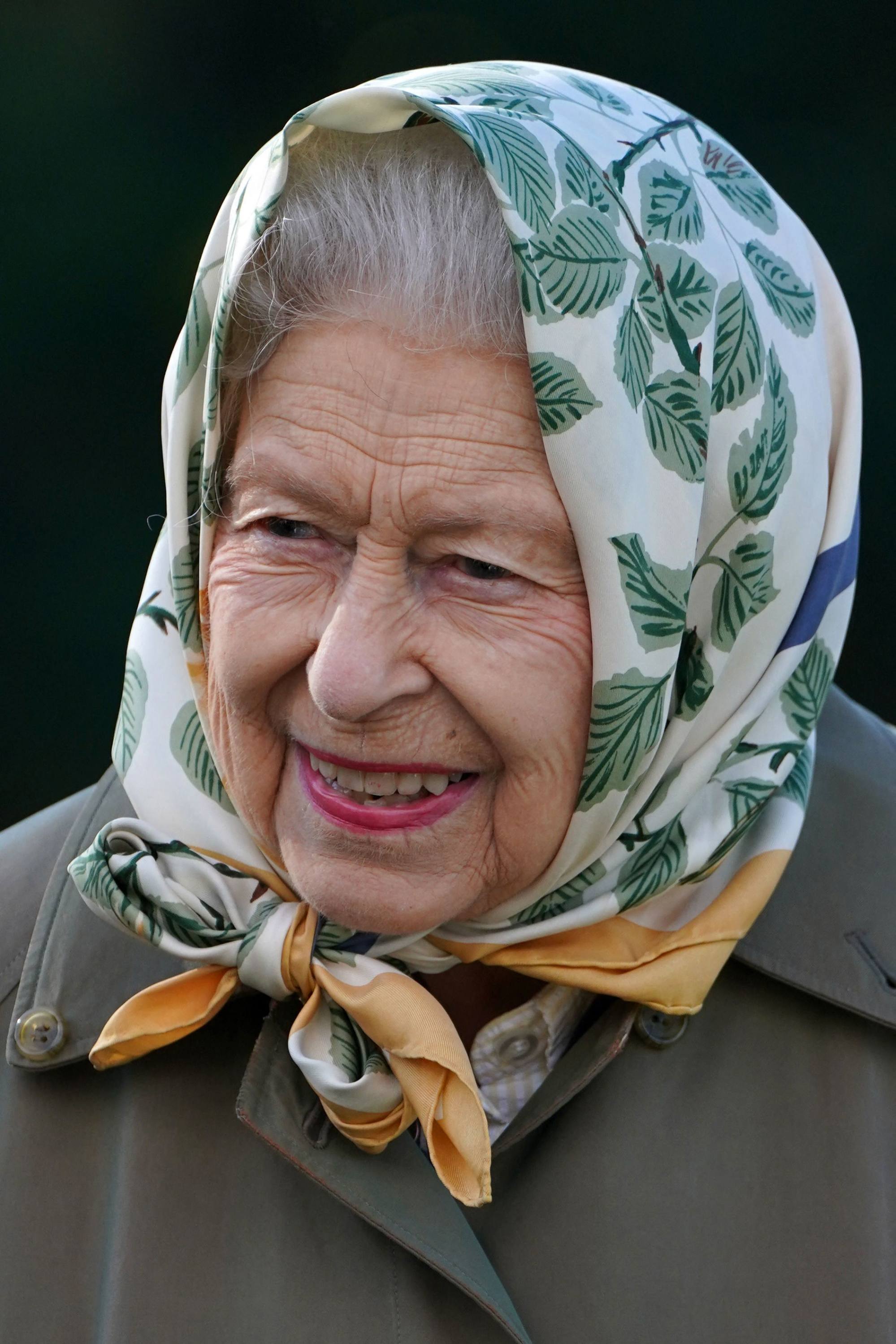 Queen Elizabeth wears a brightly coloured headscarf to attend a tree-planting event in 2021 at the Balmoral Estate, where she died on September 8. Photo: AFP/Pool