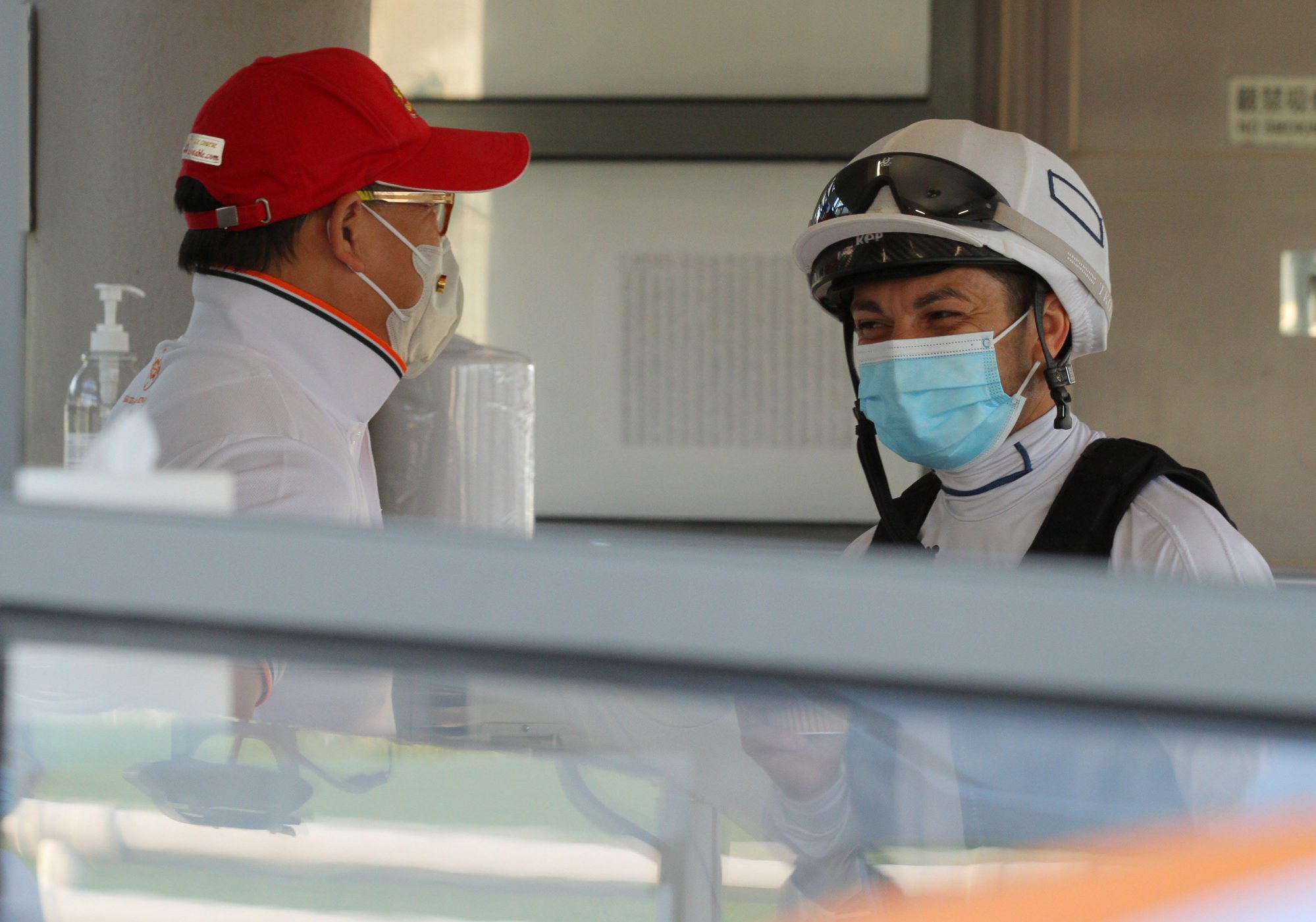 Silvestre de Sousa speaks to trainer Dennis Yip at Sha Tin Trackwork this week.