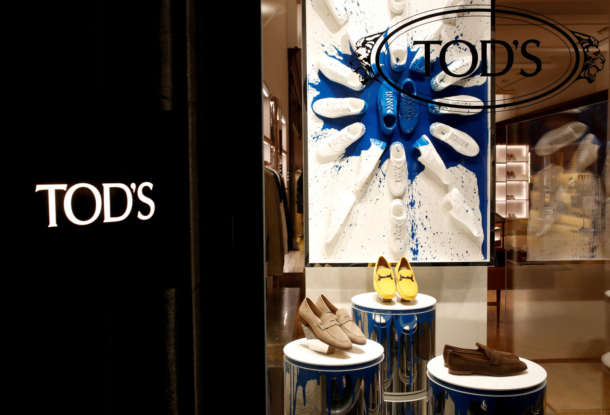 Shoes of Italian luxury shoemaker Tod’s are displayed in the window of the company’s store in Zurich, Switzerland, in April 2019. Photo: Reuters