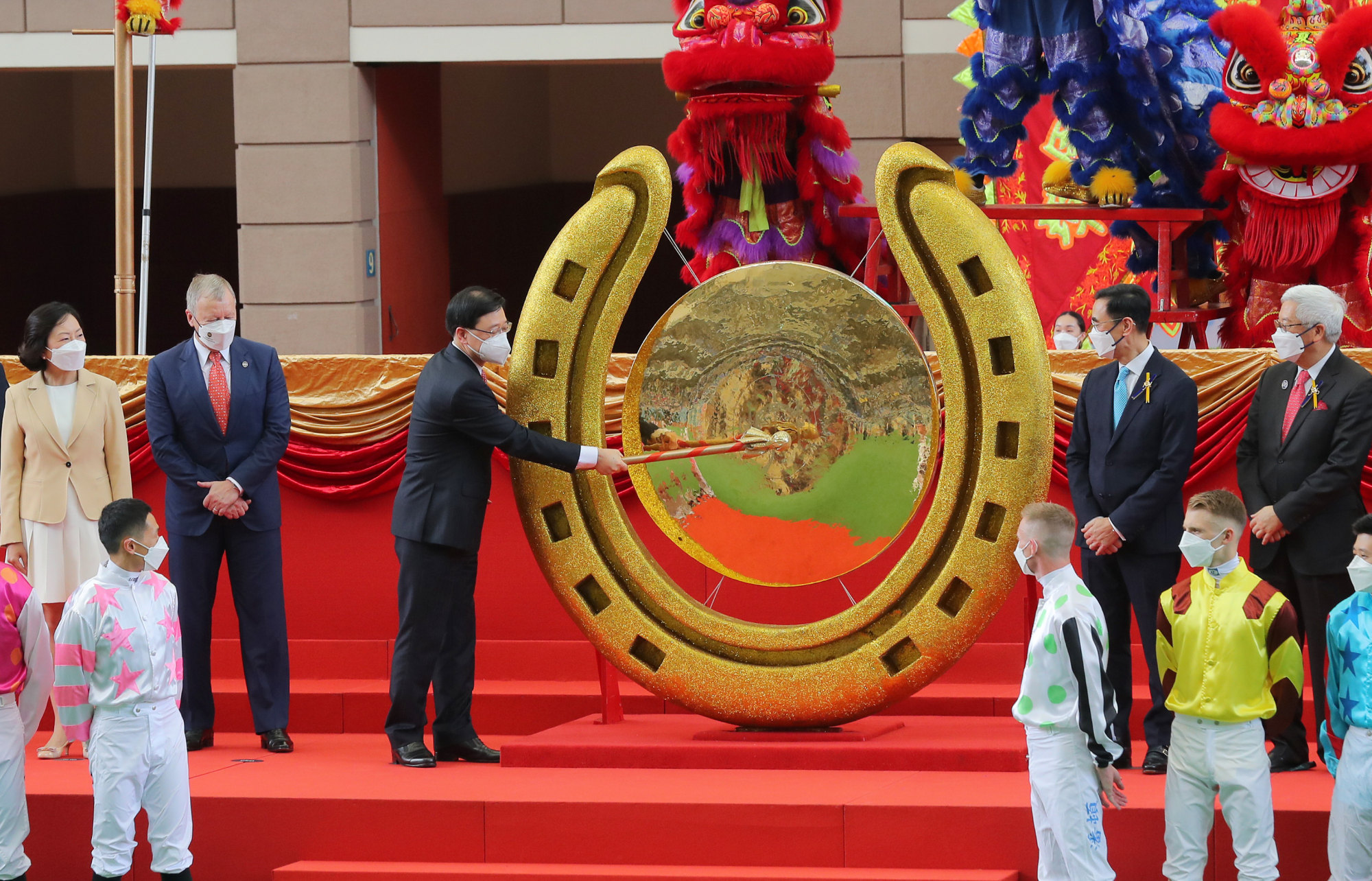 Hong Kong Chief Executive John Lee strikes the gong to open the 2022-23 racing season.