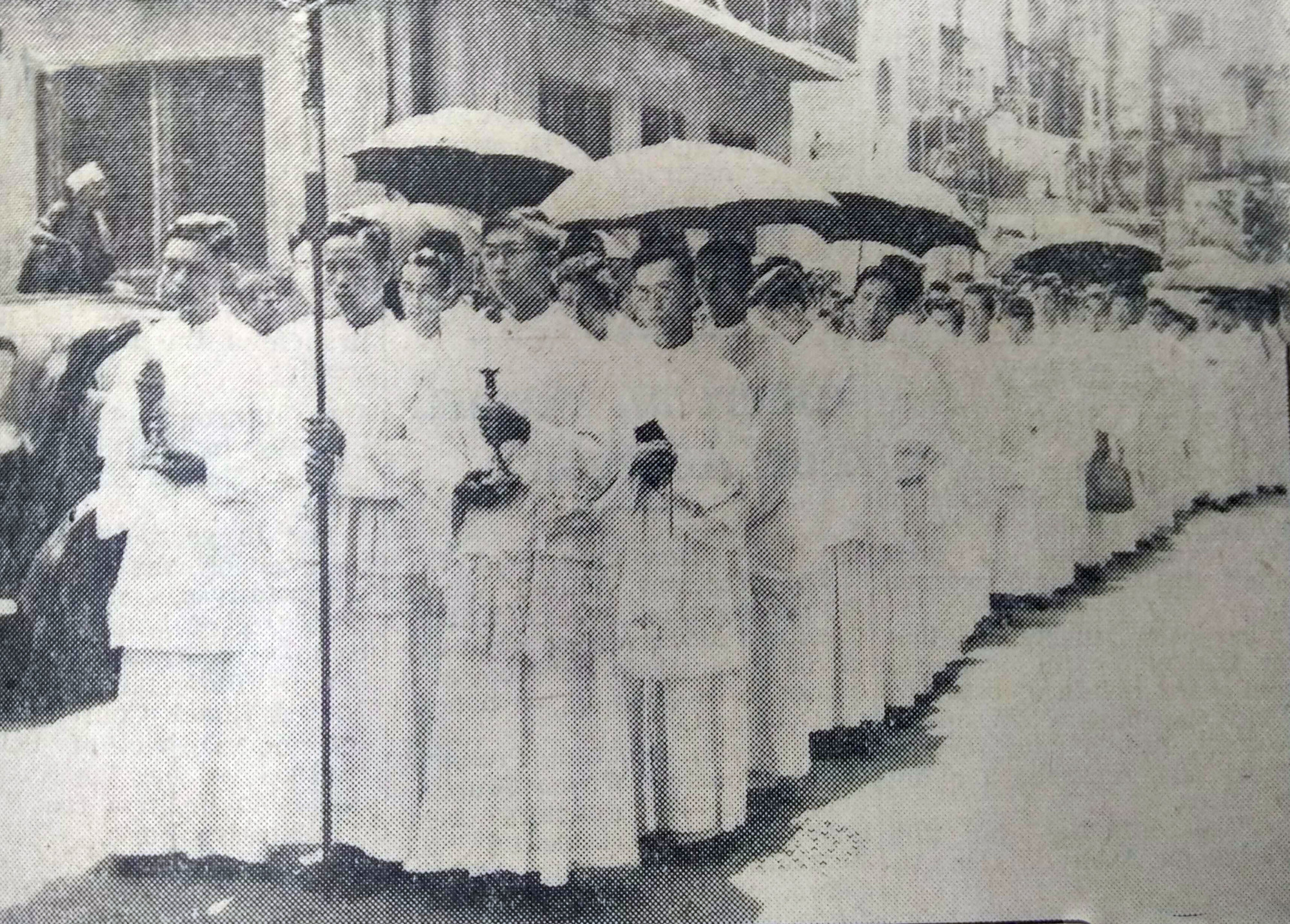 The solemn procession bearing the remains of the murdered priests from the Holy Souls Church in Wan Chai to the Catholic Cemetery in Happy Valley, Hong Kong. Photo: SCMP