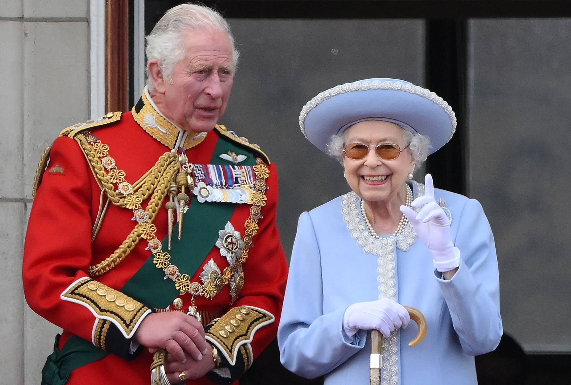 Britain’s Queen Elizabeth and her son, Prince Charles, Prince of Wales watch a special fly-past from Buckingham Palace balcony as part of her platinum jubilee celebrations in June 2022. Photo: AFP