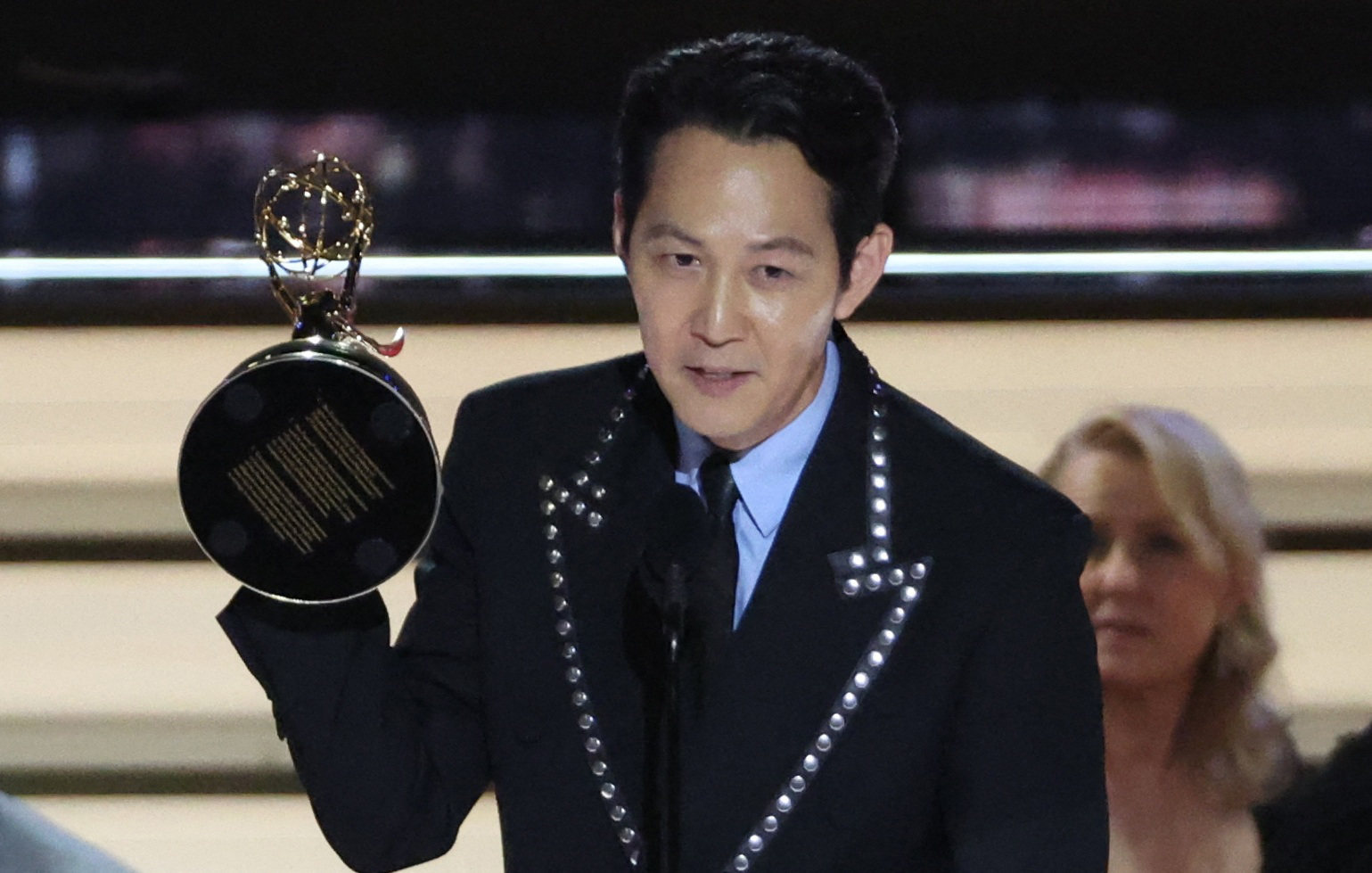 Lee Jung-jae accepts the award for outstanding lead actor in a drama series for Squid Game at the 74th Primetime Emmy Awards in Los Angeles. Photo: Reuters