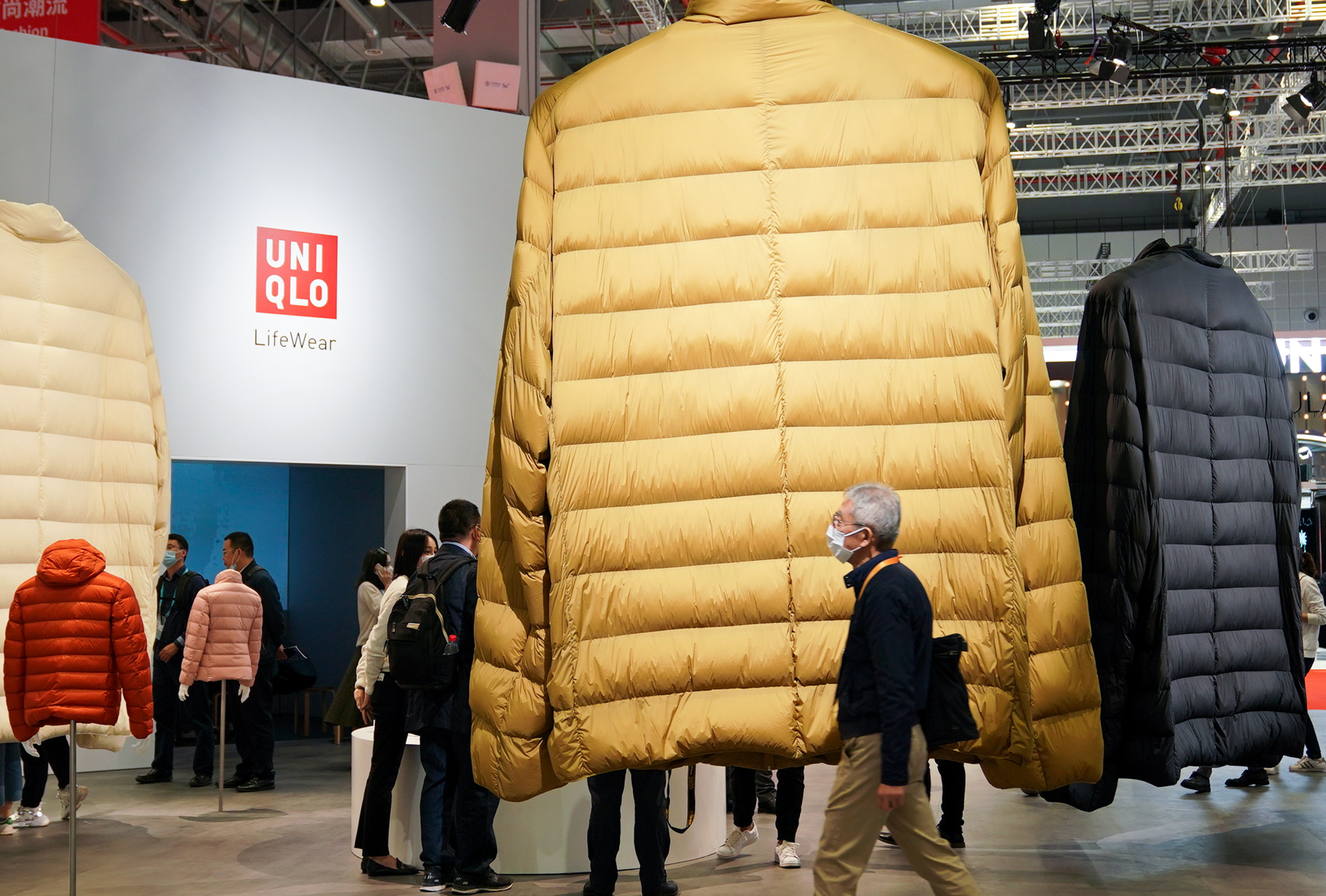 Giant down coats hang at the booth of Uniqlo during the China International Import Expo in Shanghai in November 2020. Photo: Xinhua