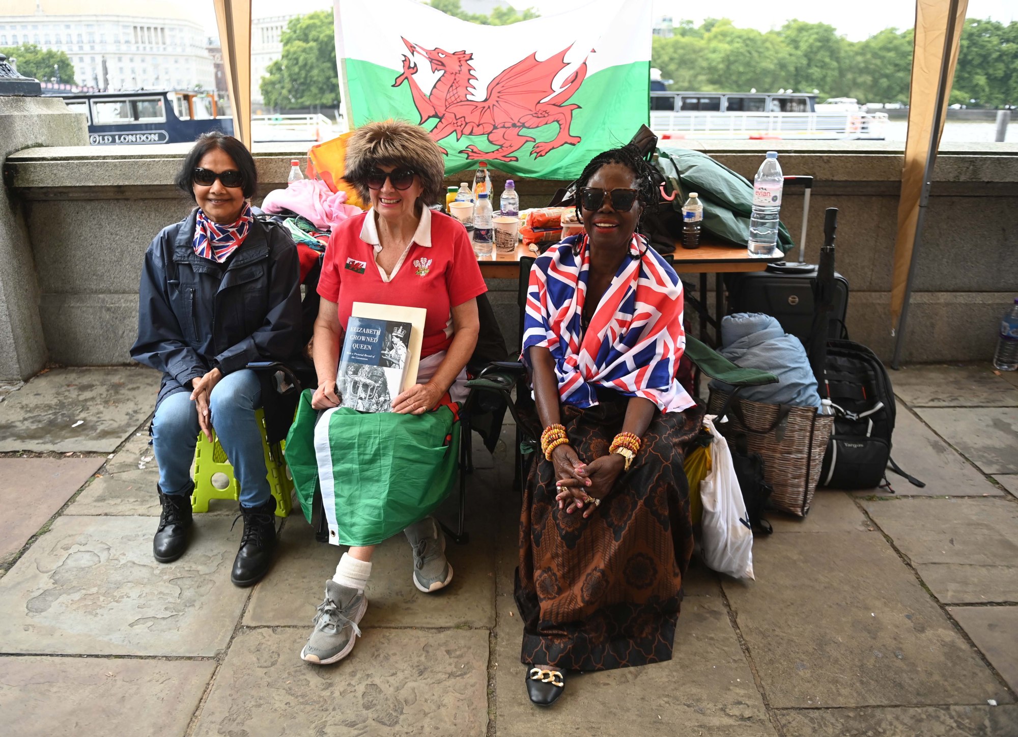Vanessa Nathakumaran (left), who was the first person to arrive at the designated location to queue in Victoria Tower Gardens for Britain’s Queen Elizabeth’s lying in state in London. Photo: EPA-EFE