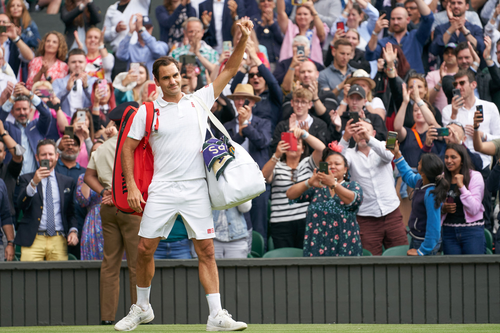 Roger Federer waving farewell to fans at the All England Lawn Tennis and Croquet Club in July 2021. Photo: USA Today