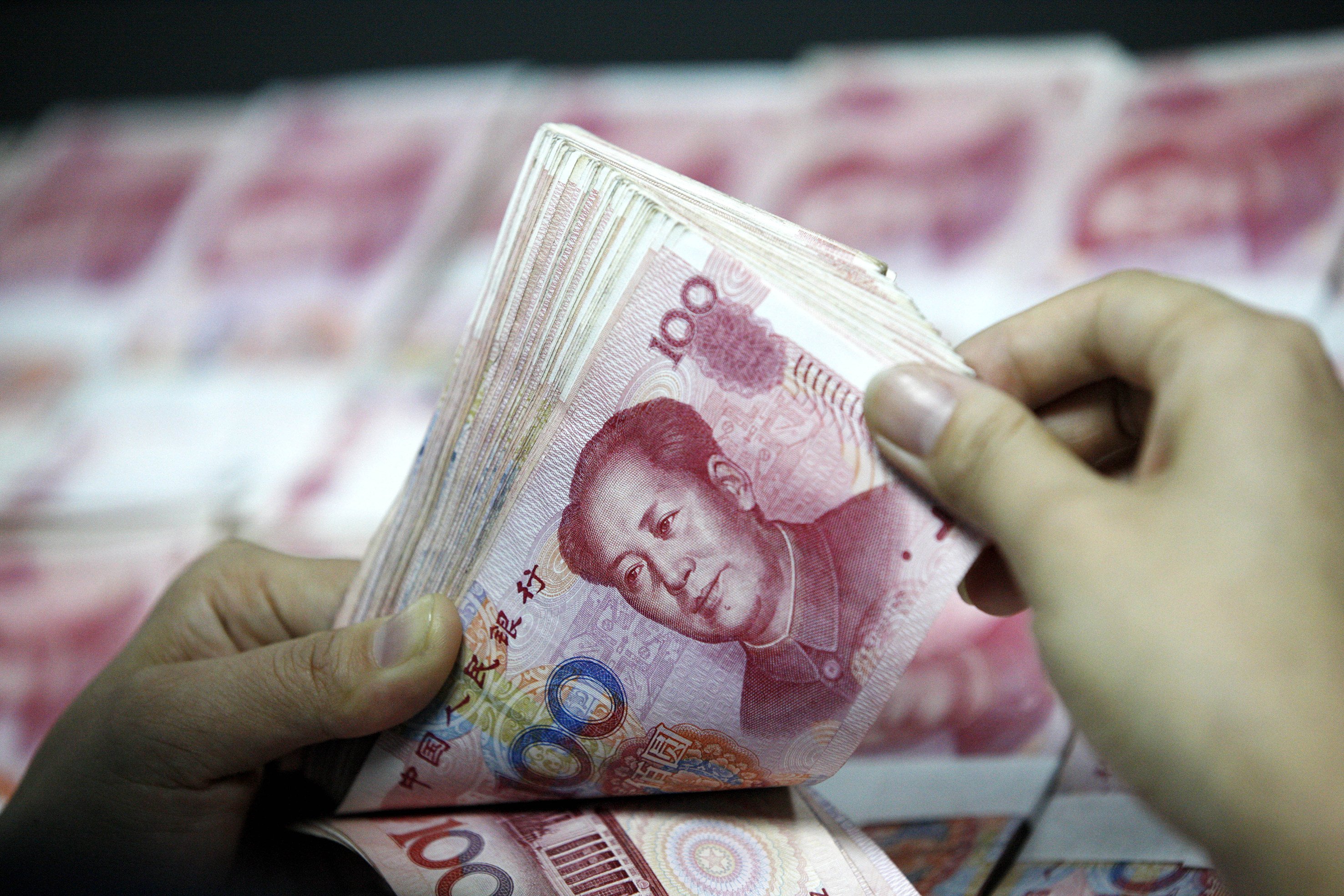 China’s onshore yuan breached the psychological threshold of 7 per US dollar on Friday morning, following the overnight weakening in offshore markets. Photo: Shutterstock