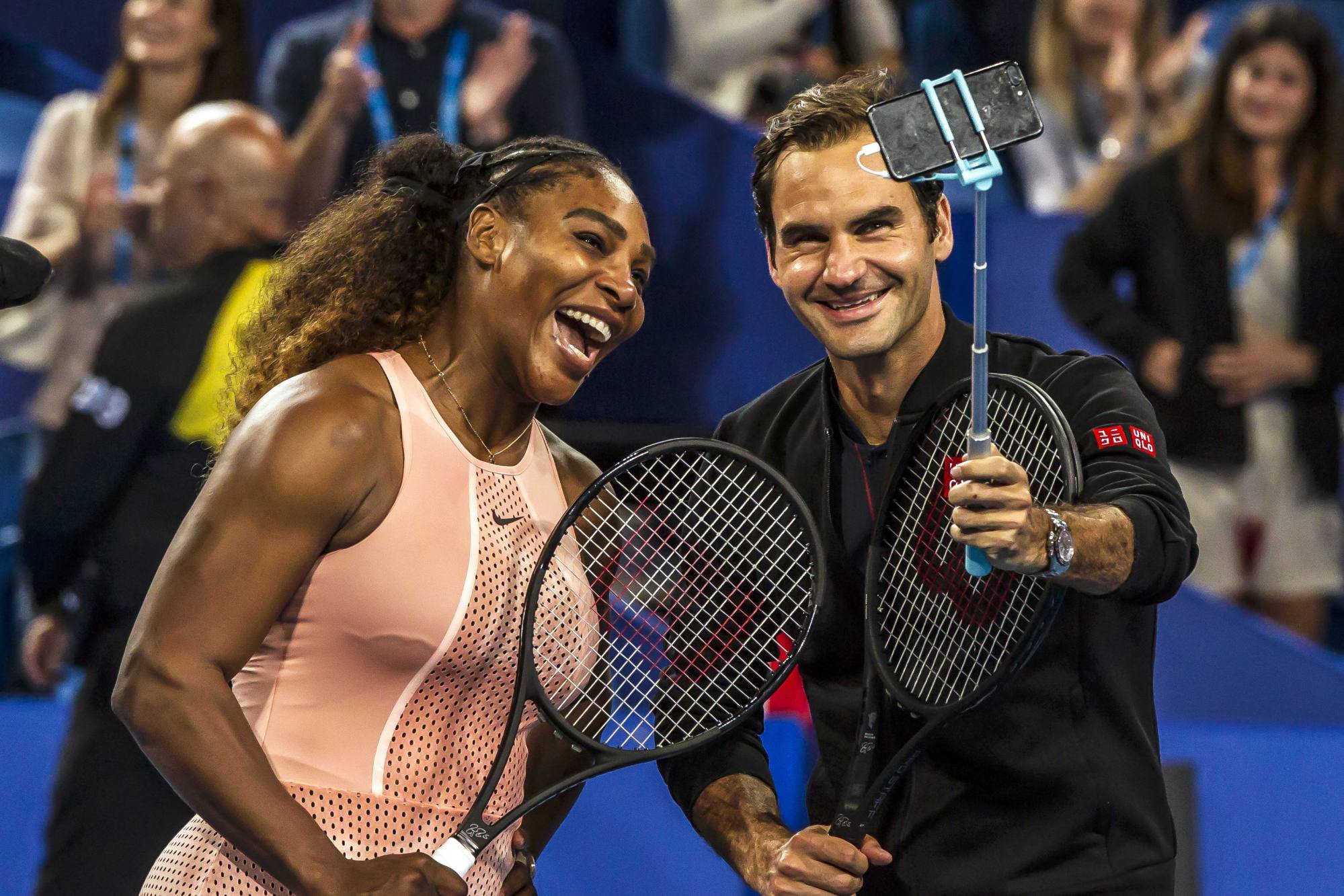 Serena Williams and Roger Federer take a selfie following their mixed doubles match on day four of the Hopman Cup tennis tournament in Perth. Photo: AFP