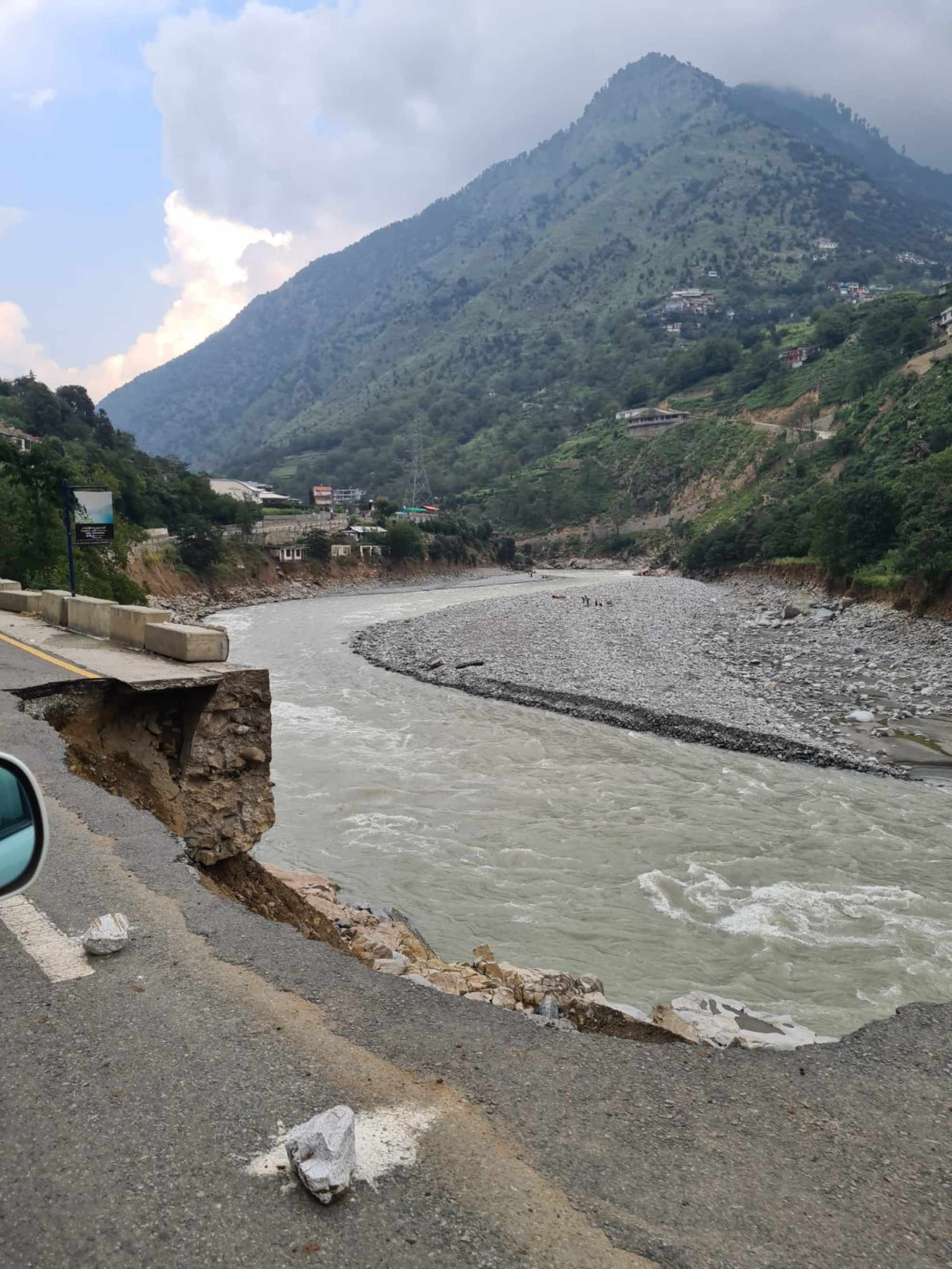 Flood damage to the main highway marked by whitewashed rocks in Swat, northern Pakistan. Photo: Handout