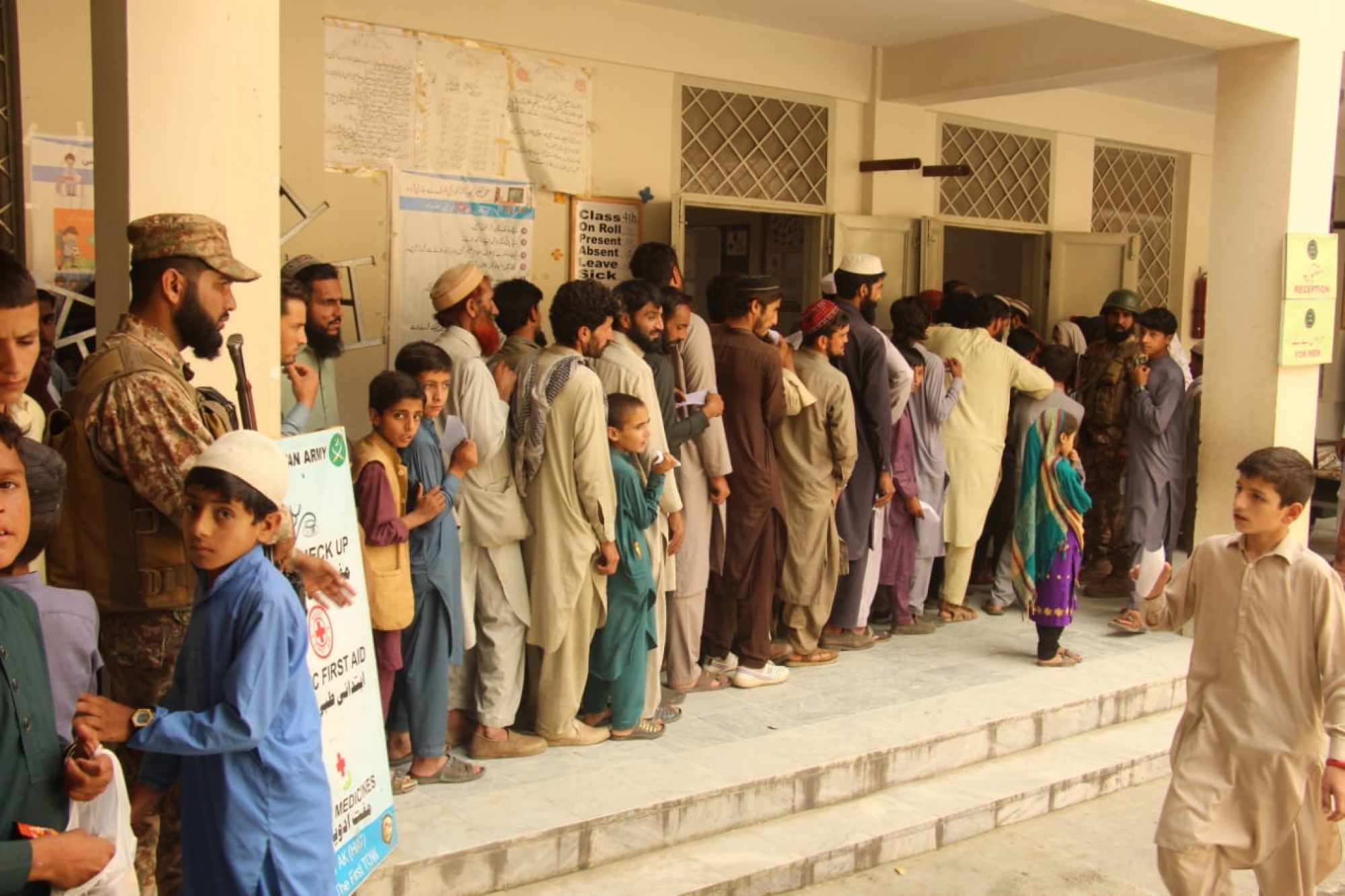 Men queue to be checked by army doctors in Swat, Pakistan. Photo: Pakistan Inter Services Public Relations
