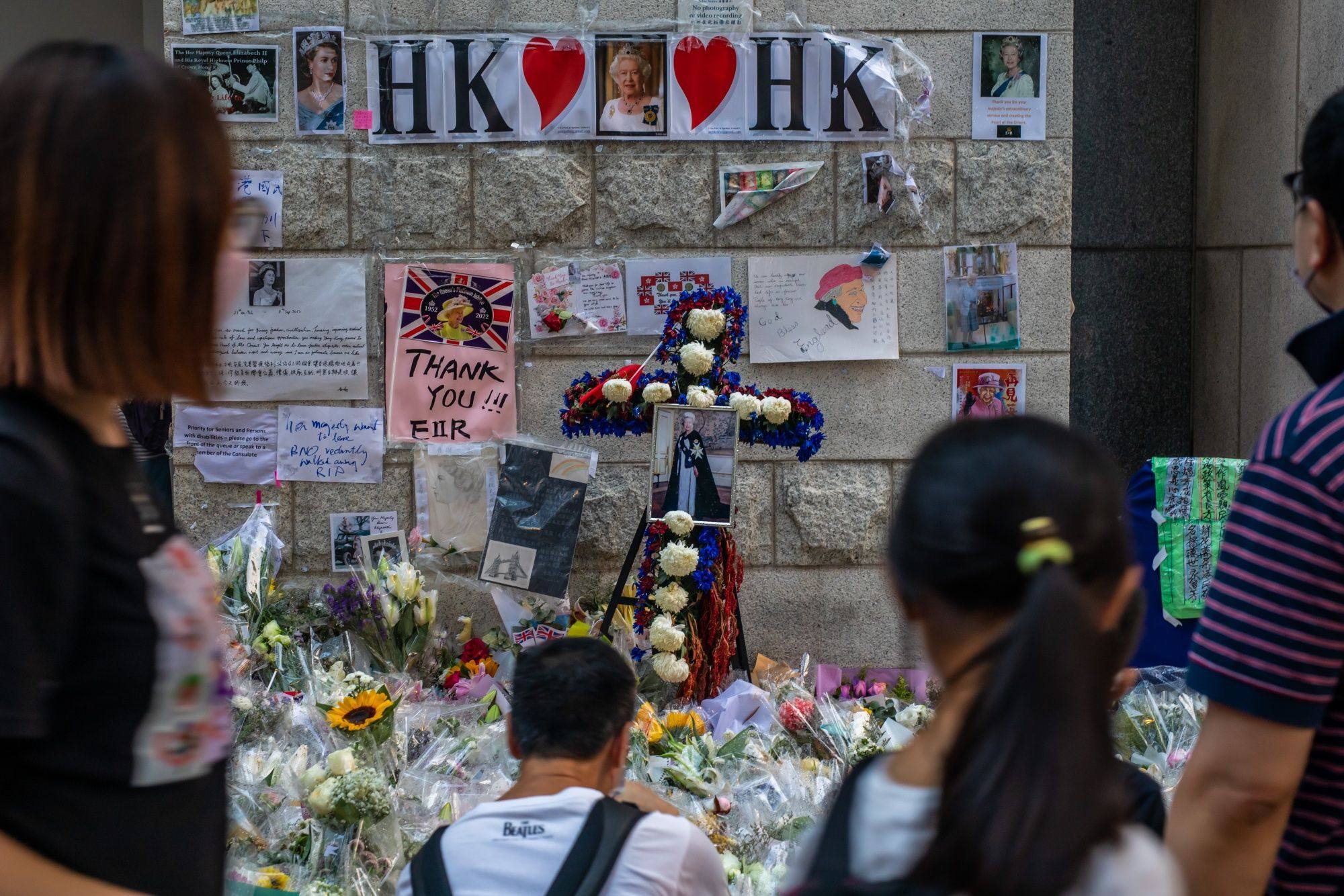 In Hong Kong, the death of Queen Elizabeth has kindled a mass outpouring of mourning where massive queues of Hong Kong residents paid tribute at the British consulate. Photo: Bloomberg