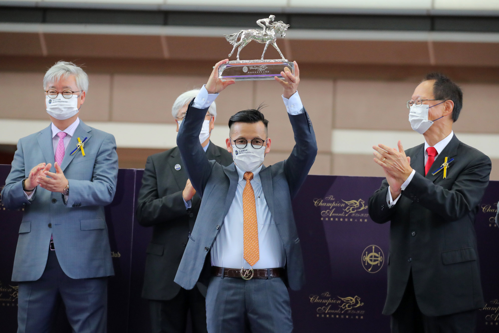 Frankie Lor lifts his first champion trainer trophy after saddling 90 winners in the 2021-22 season.