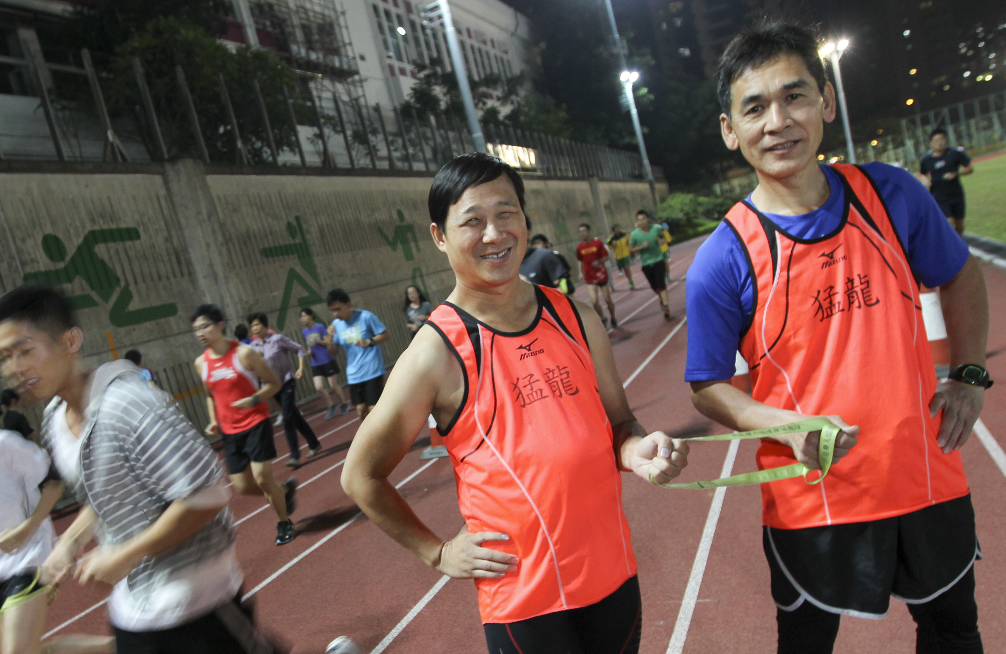 Kim Mok (left) and guide Yeung Yuk-wing at Hammer Hill Road Sports Ground. Photo: SCMP