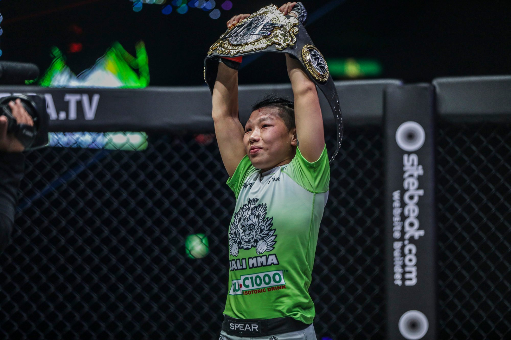 ‘The Panda’ Xiong Jingnan lifts her strawweight title at ONE: A New Era in Tokyo, Japan.