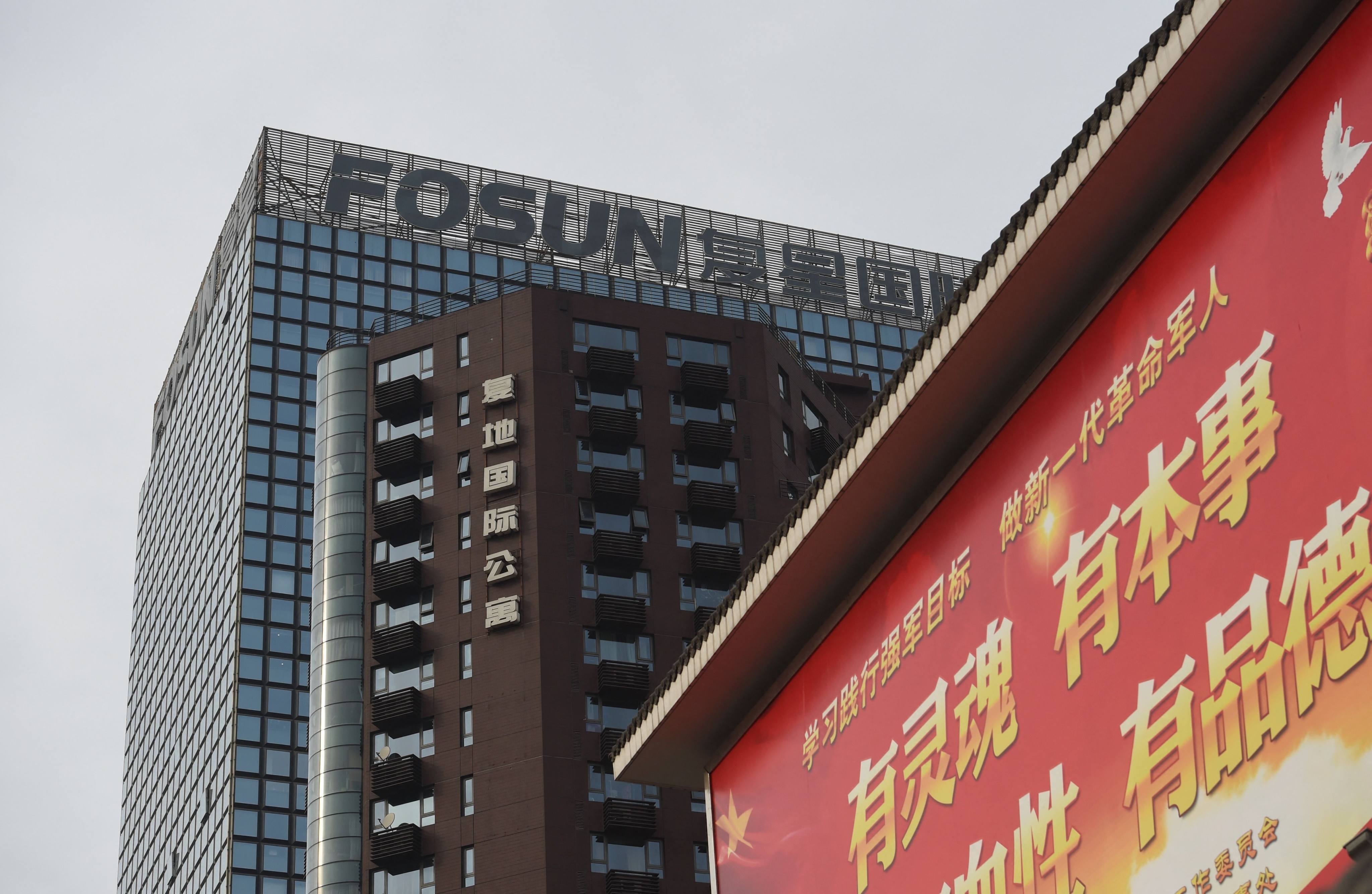 The logo of Chinese conglomerate Fosun seen on top of a building in Beijing. Photo: AFP