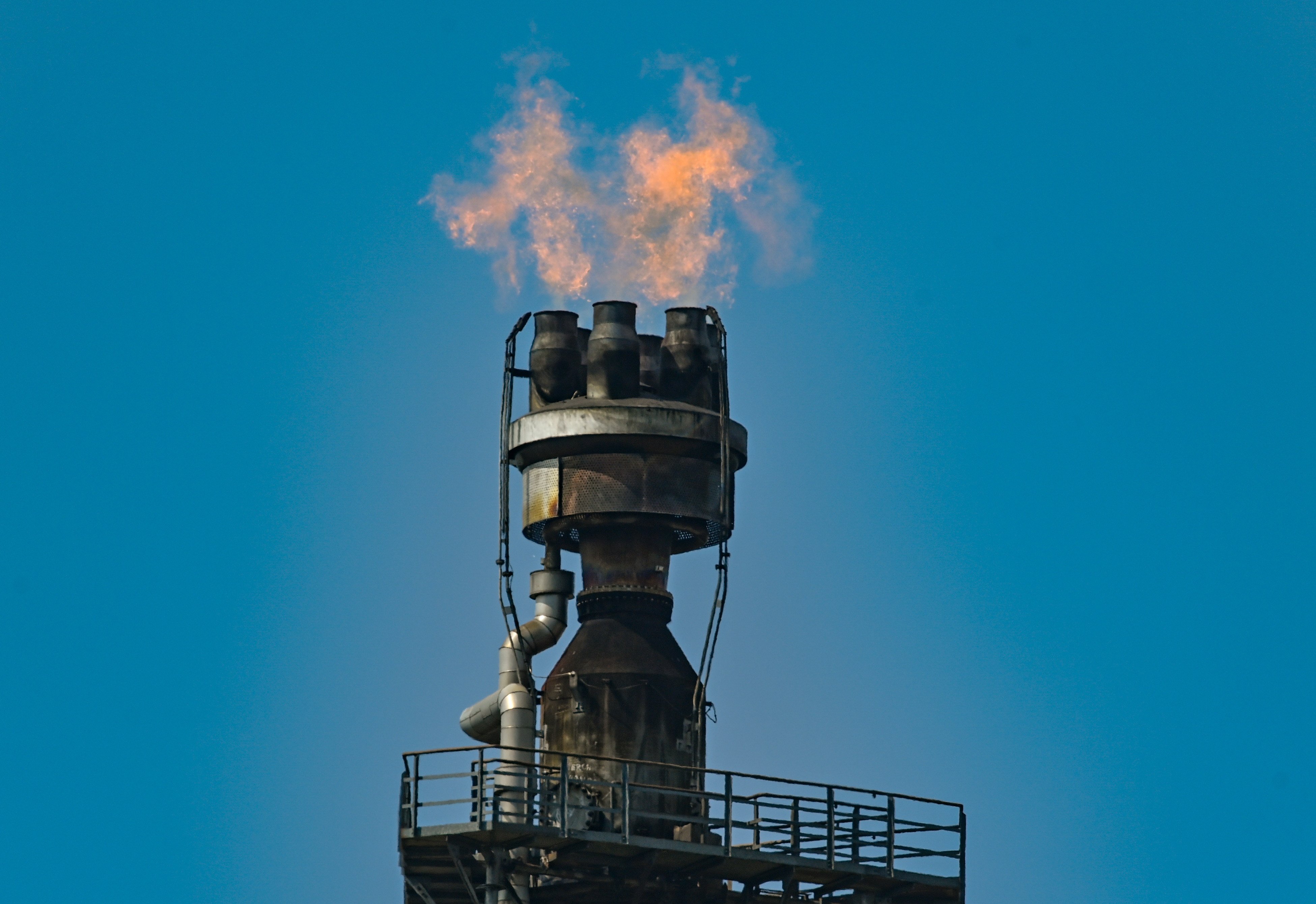 Surplus gas burns at the PCK Petroleum Refinery in Brandenburg, Schwedt, Germany on May 2. Last year, Rosneft took over a large part of the refinery which processes 12 million tonnes of crude oil annually, making it one of the largest processing sites in Germany. Photo: dpa