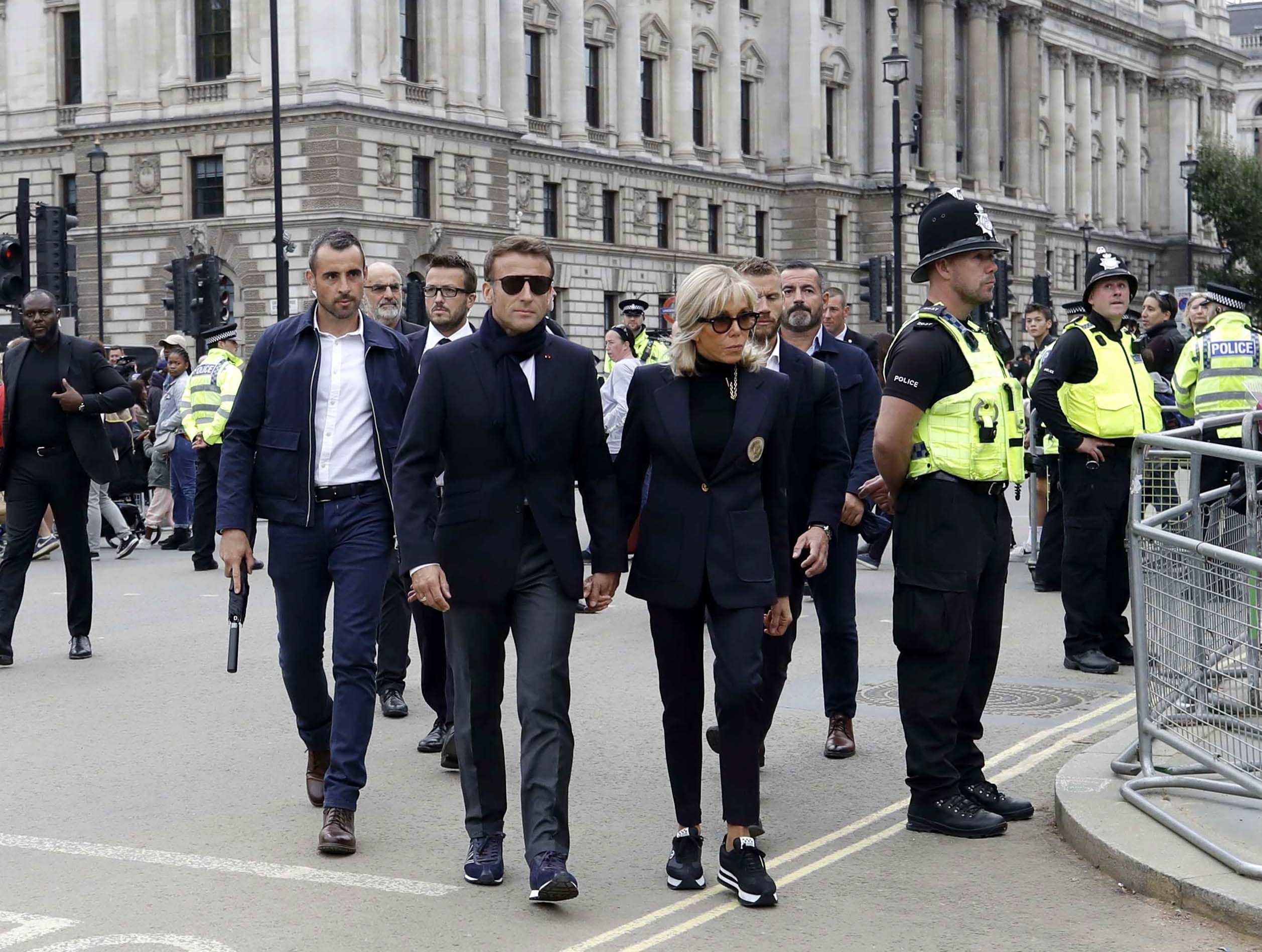 French President Emmanuel Macron (centre left) and his wife Brigitte Macron arrive at Westminster Hall to pay their respects to Britain’s late Queen Elizabeth II.  Photo: EPA-EFE/Olivier Hoslet