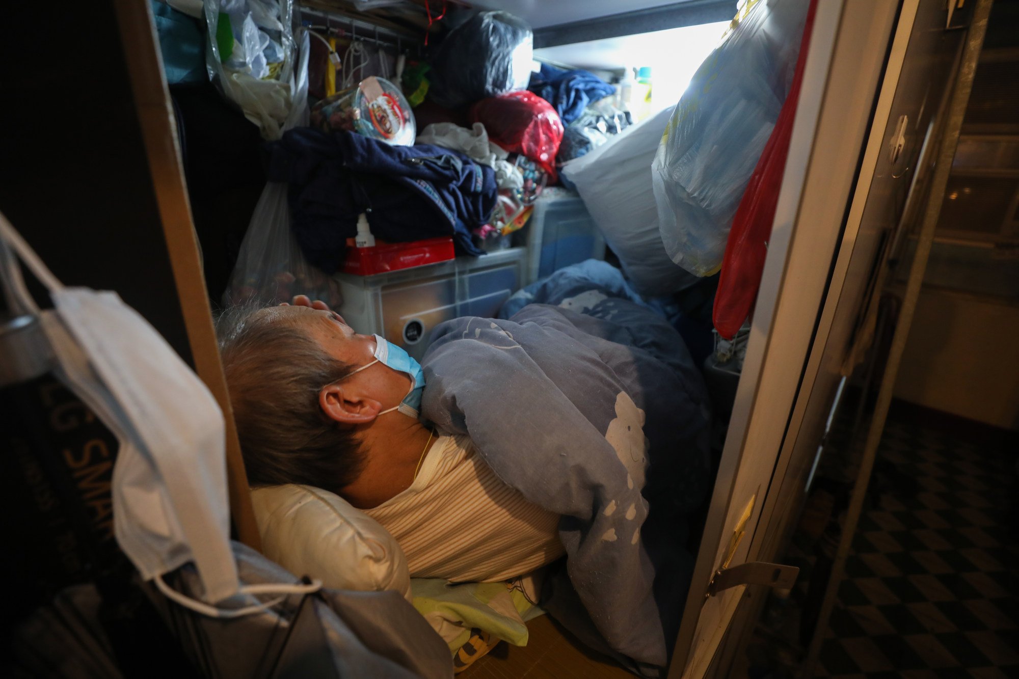 Yau Sai, 68, pays HK$2,000 a month for his limited space. Photo: Xiaomei Chen