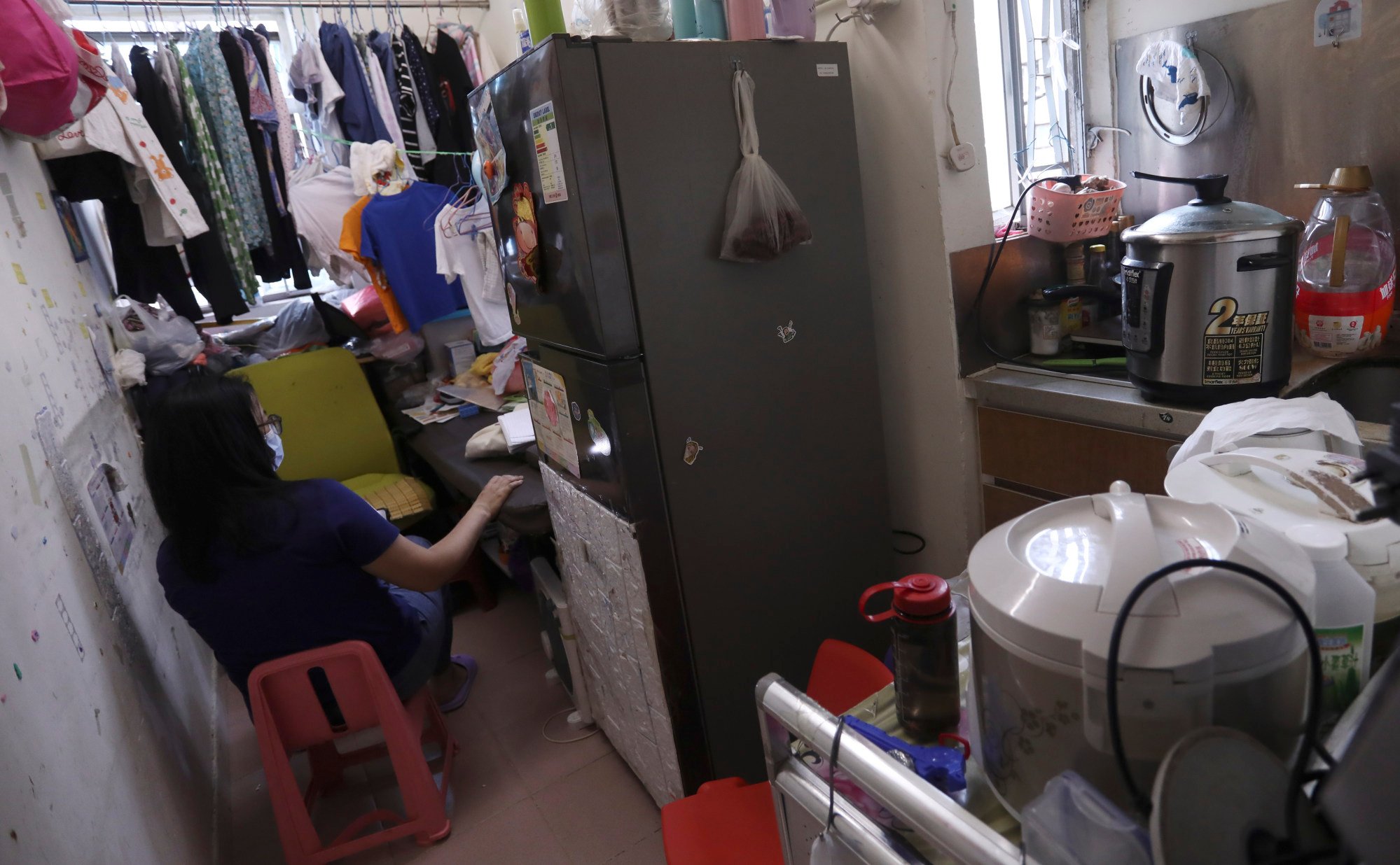 Siumei at her subdivided flat in Mong Kok. Photo: Jonathan Wong