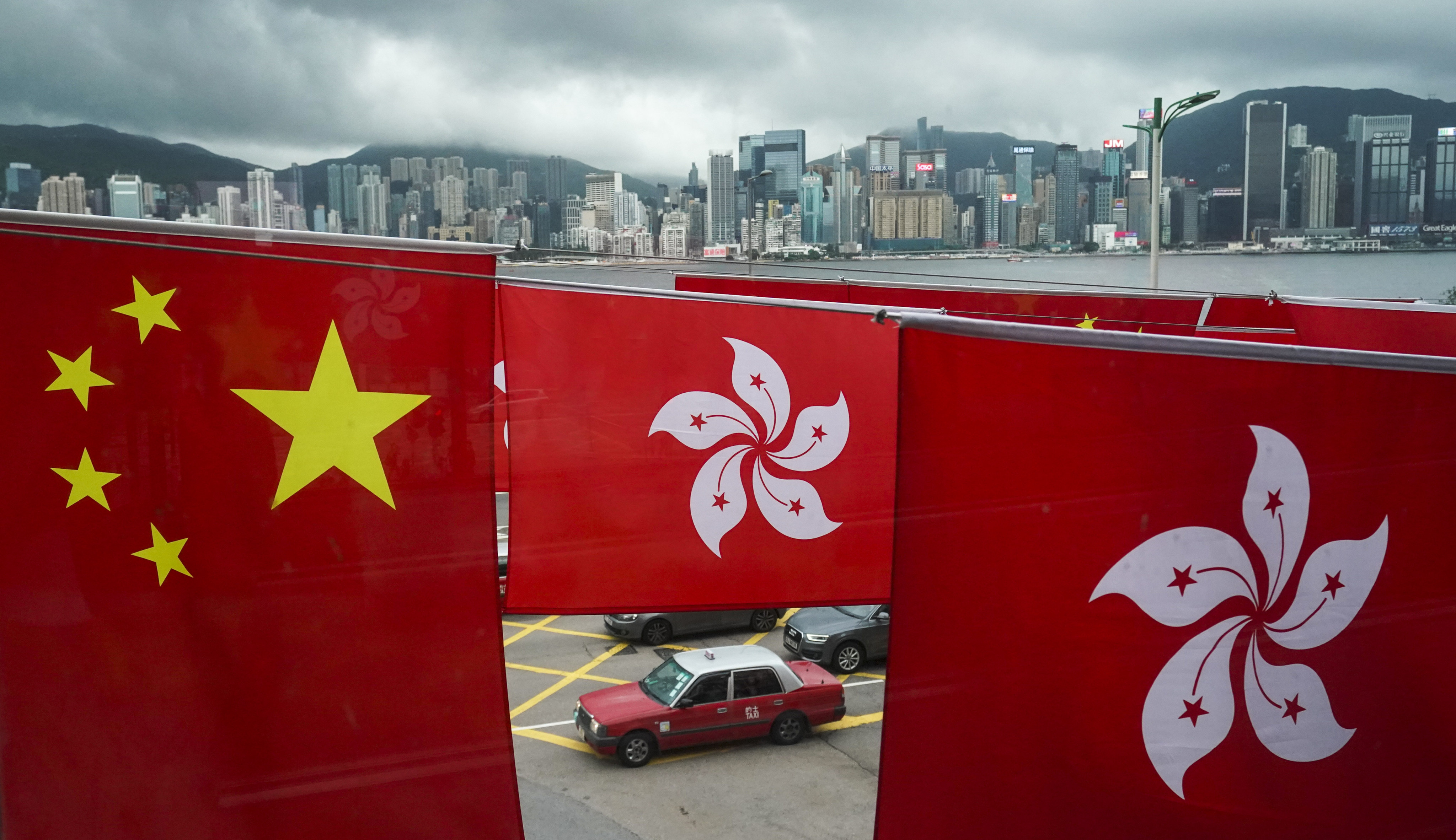 The flags of China and Hong Kong SAR are displayed to celebrate the 25th anniversary of Hong Kong’s handover, in Tsim Sha Tsui on June 20. Photo: Felix Wong