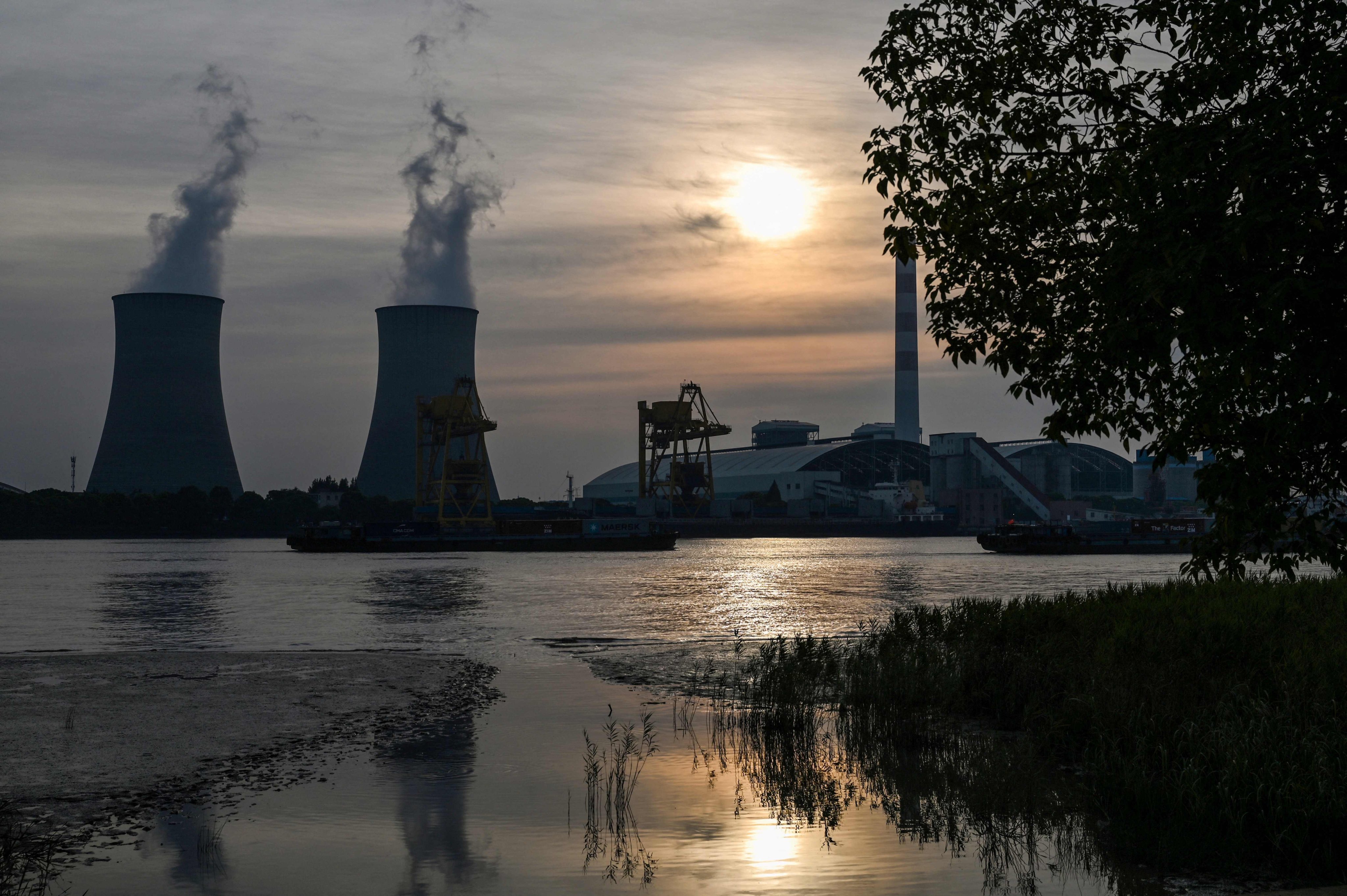 The Wujing coal power station is pictured across the Huangpu River, in the Minhang district of Shanghai, on August 22. China’s coal output hit record levels earlier this year. Photo: AFP