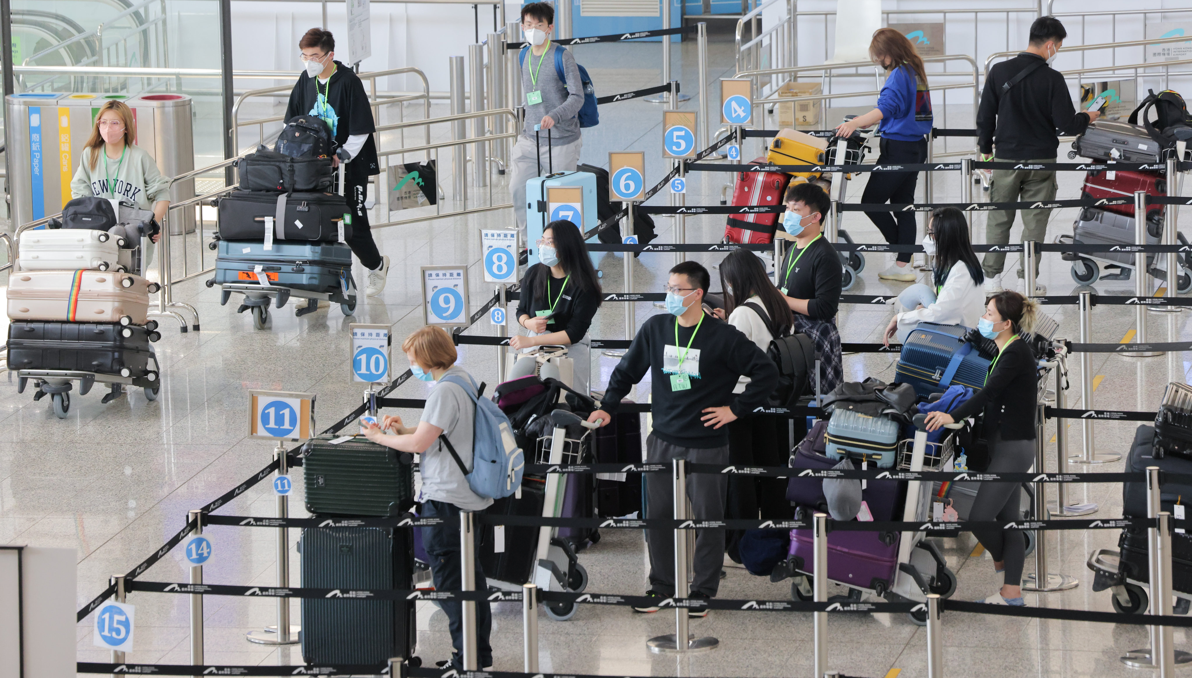 Passengers line up at a quarantine processing area  in the arrivals hall at Hong Kong International Airport on Wednesday.  Photo: Jelly Tse