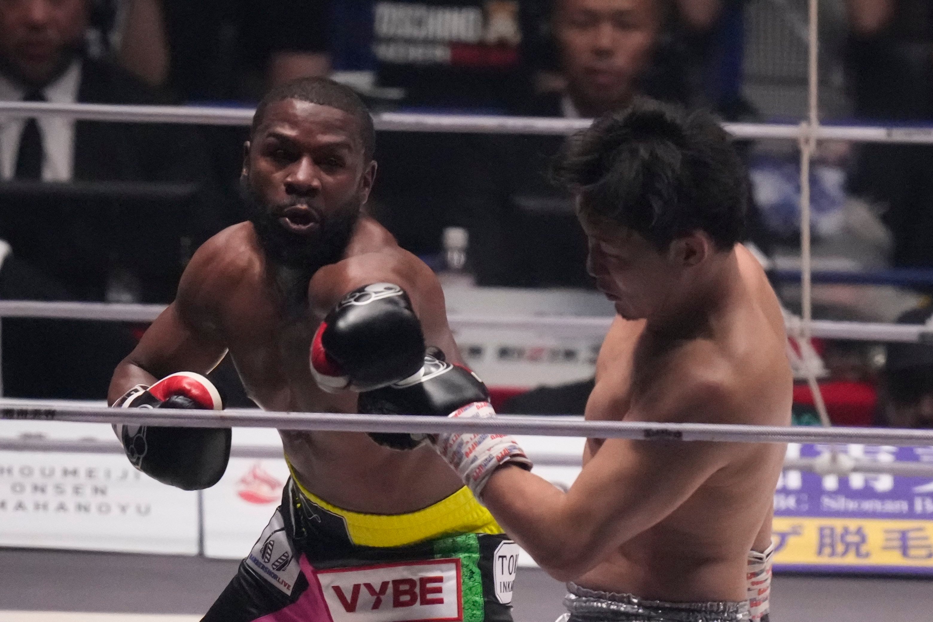 Boxer Floyd Mayweather of the US throws a punch against mixed martial artist Mikuru Asakura of Japan at the Super Rizin event in Saitama. Photo: AP