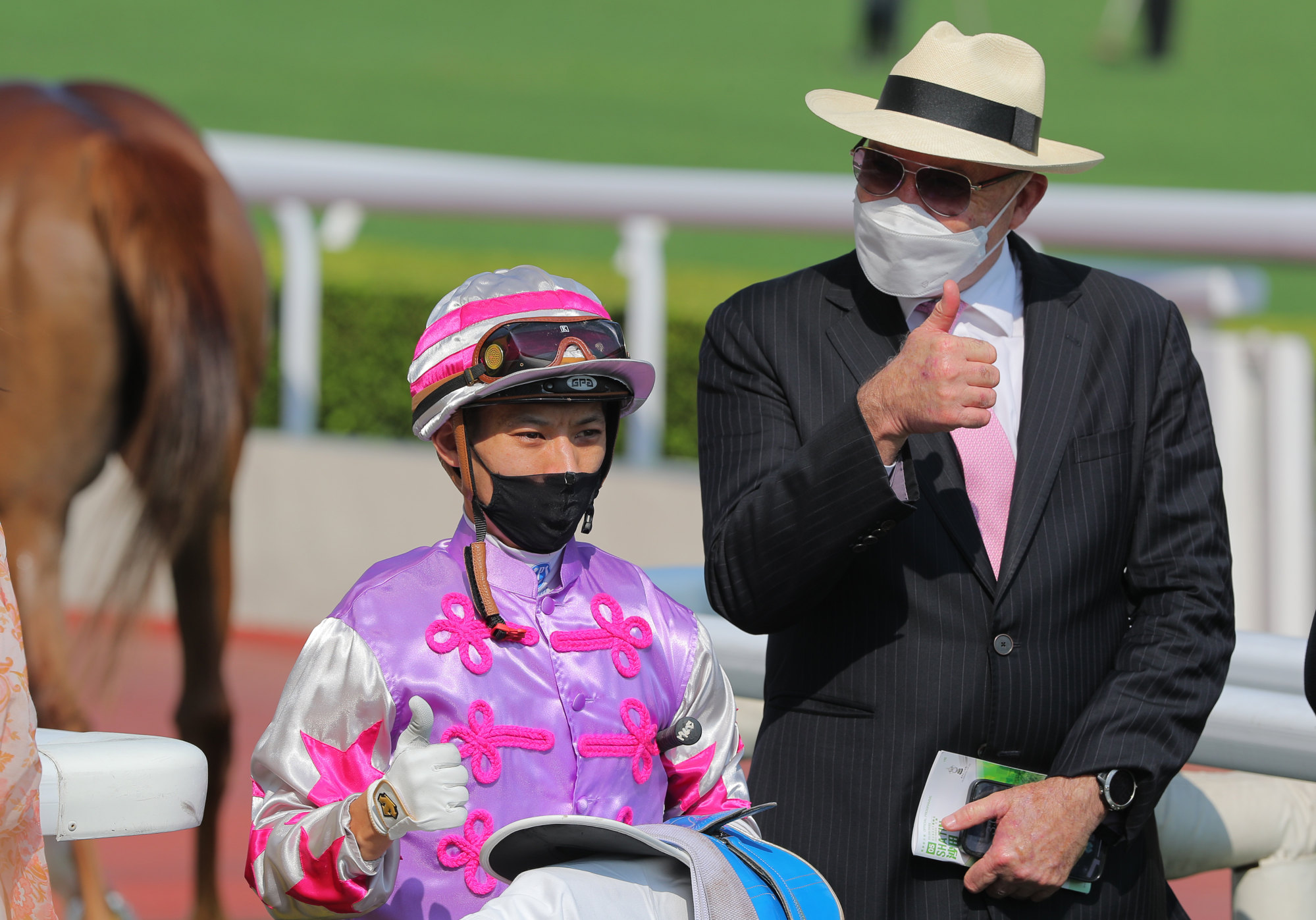 Jockey Matthew Chadwick and trainer David Hayes celebrate Star Contact’s victory.