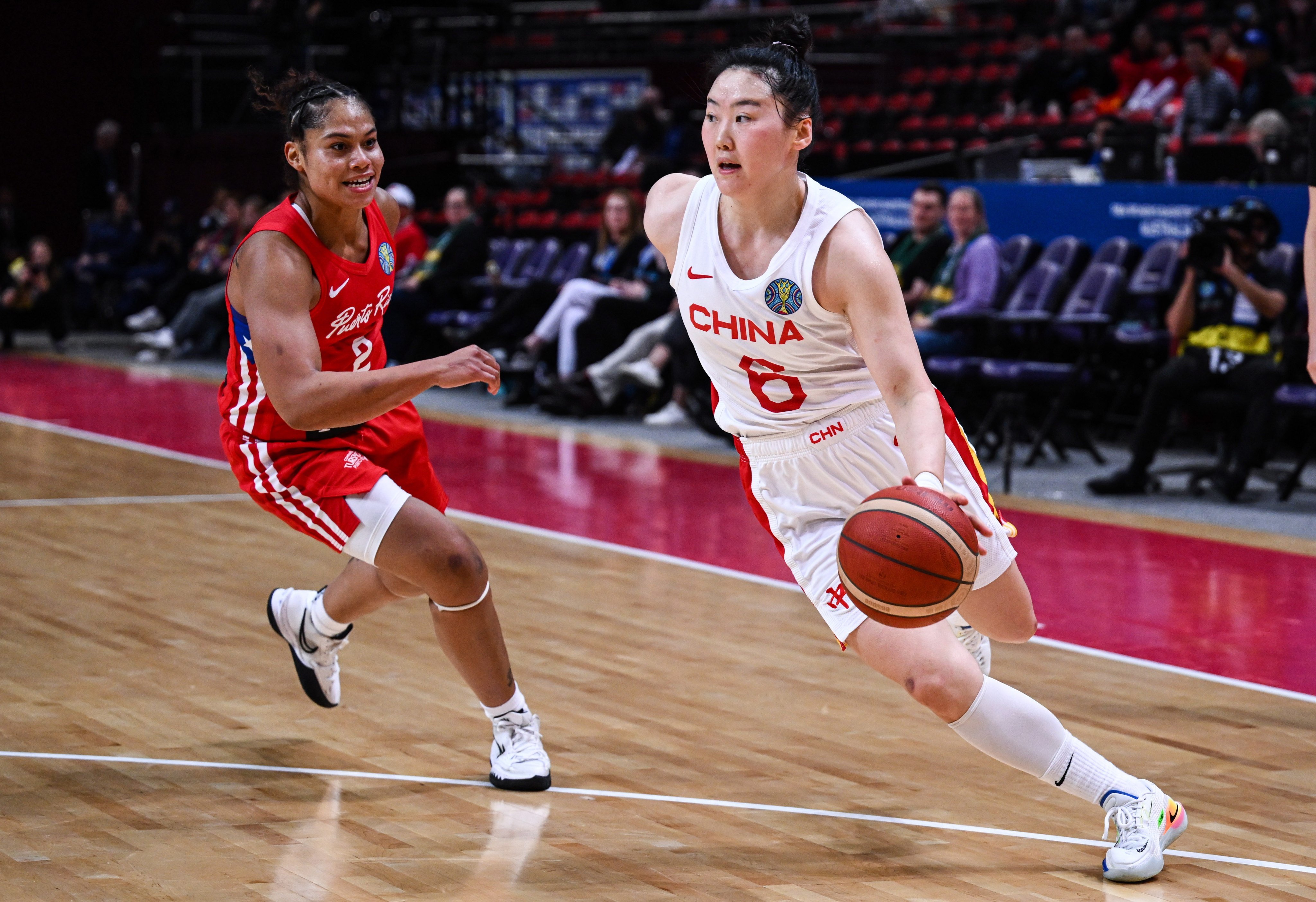 China’s Wu Tongtong (right) drives to the basket during her team’s Women’s Basketball World Cup match against Puerto Rico. Photo: EPA-EFE