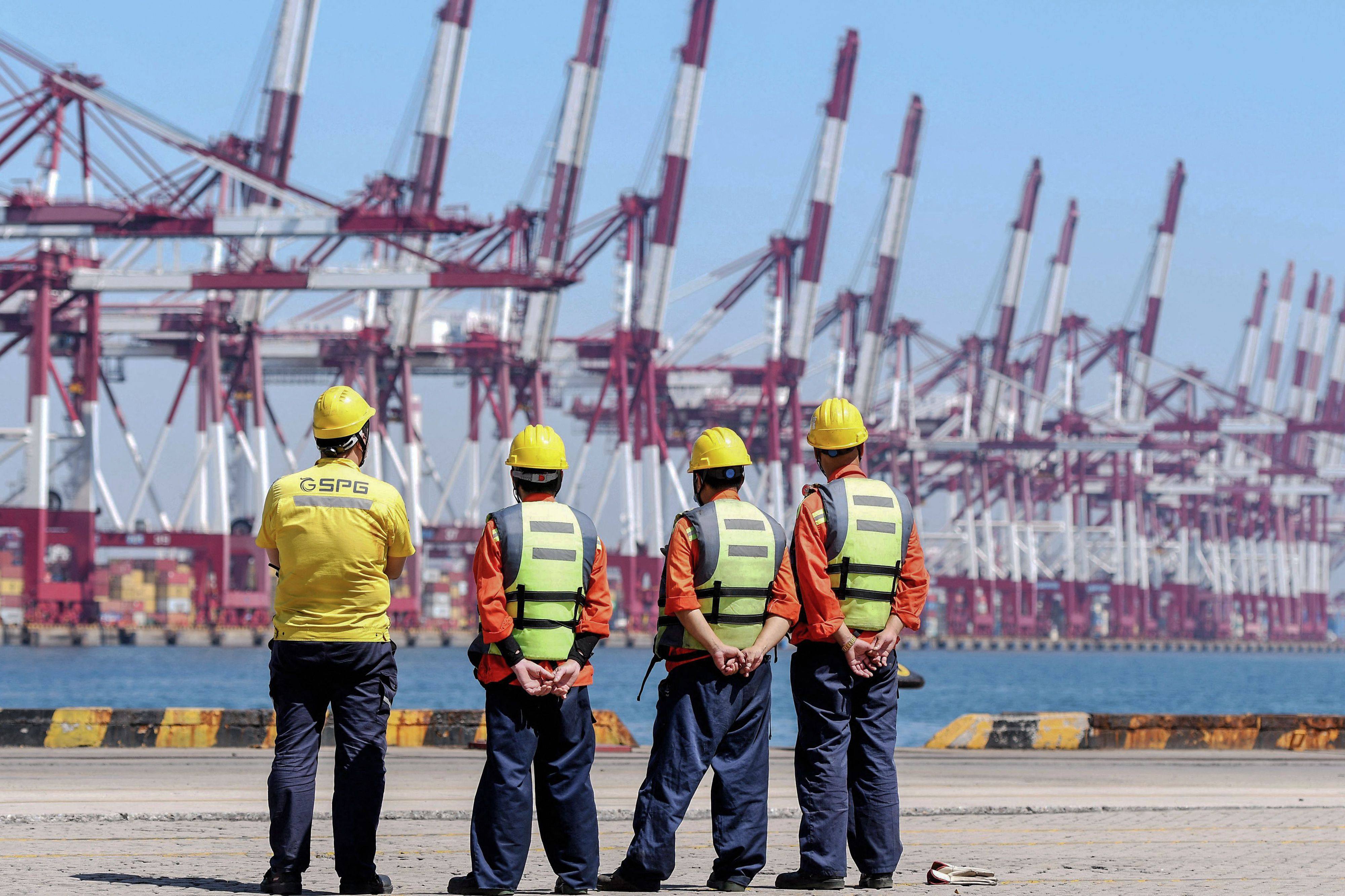 Employees look on at a port in Qingdao in China’s eastern Shandong province on September 7. It is highly improbable that growth in net exports will be the main driver of the Chinese economy for much longer. Photo: AFP