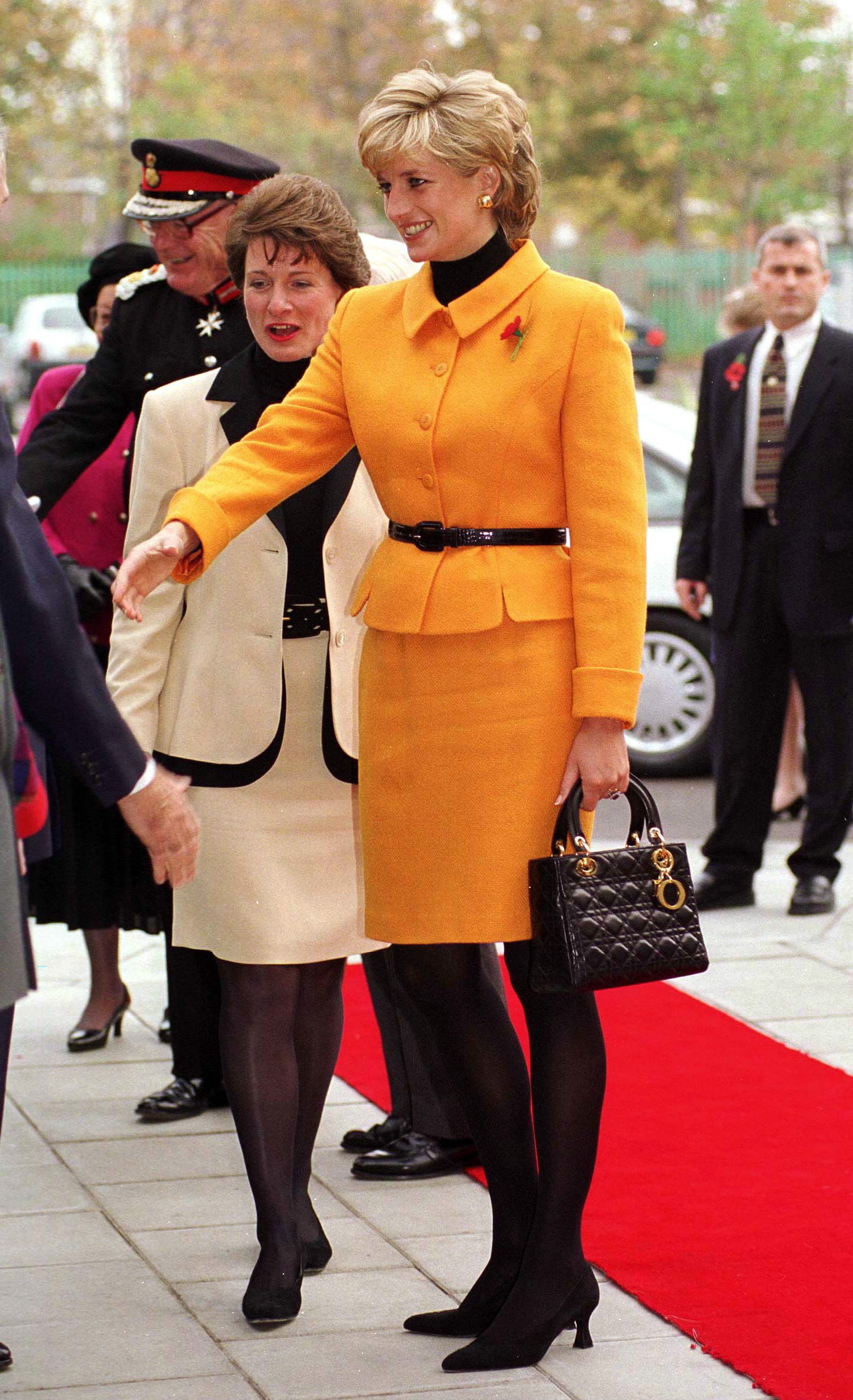 Princess Diana carries a Lady Dior handbag at a public engagement in Liverpool, in the UK. Photo: Getty Images