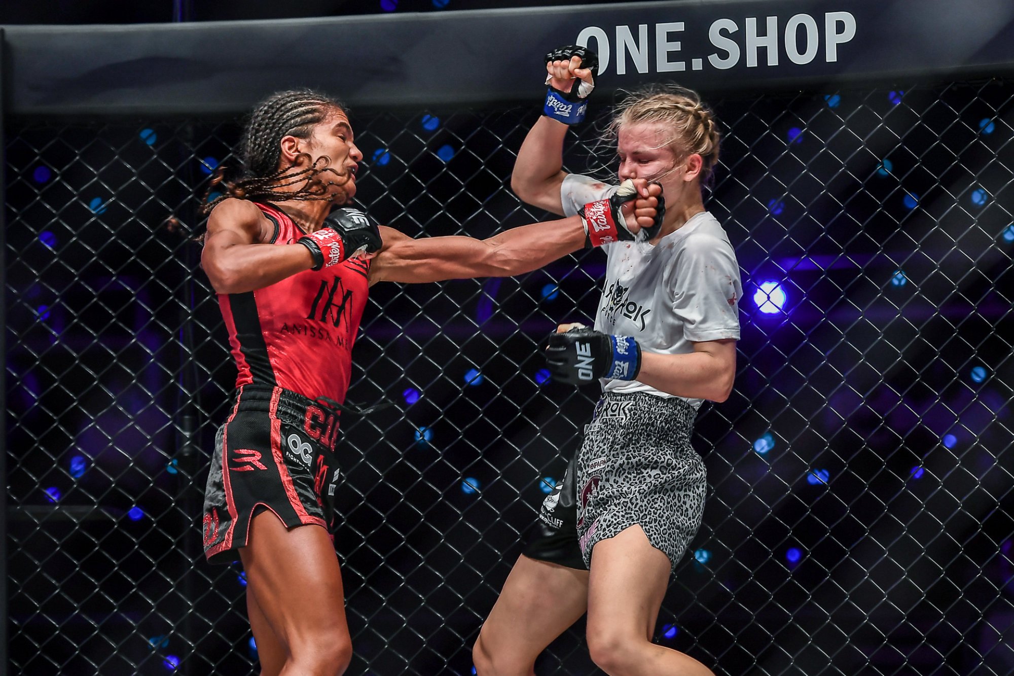 Anissa Meksen (left) cracks Marie Ruumet with a left hand at ONE 156 in Singapore.