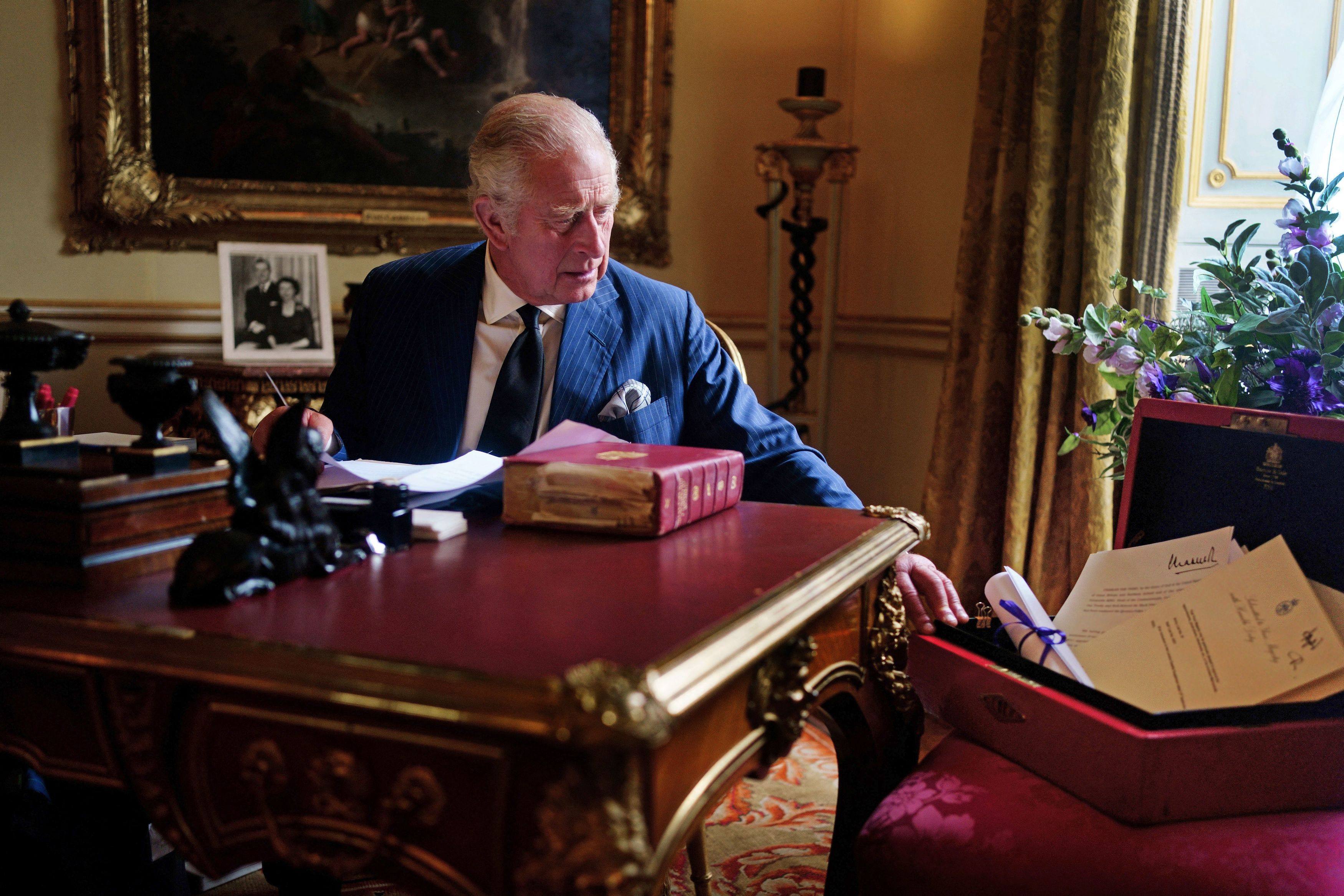 King Charles carrying his official government duties from his red box in the Eighteenth Century Room at Buckingham Palace, London on September 11. Photo: Buckingham Palace/AFP 