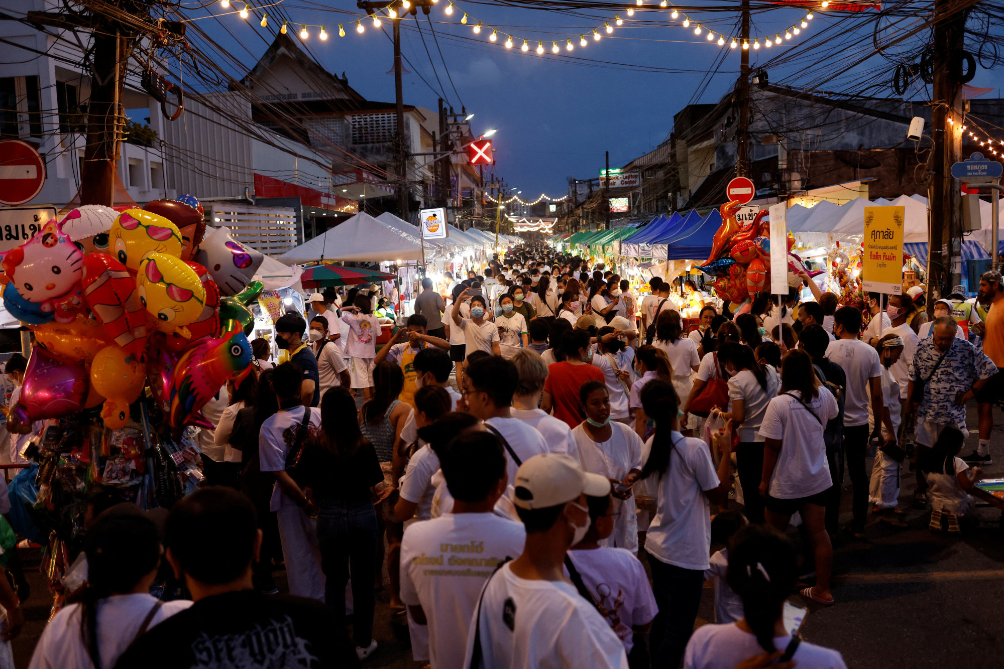 People dressed in white flock to the annual vegetarian festival in Phuket on Tuesday. Photo: Reuters
