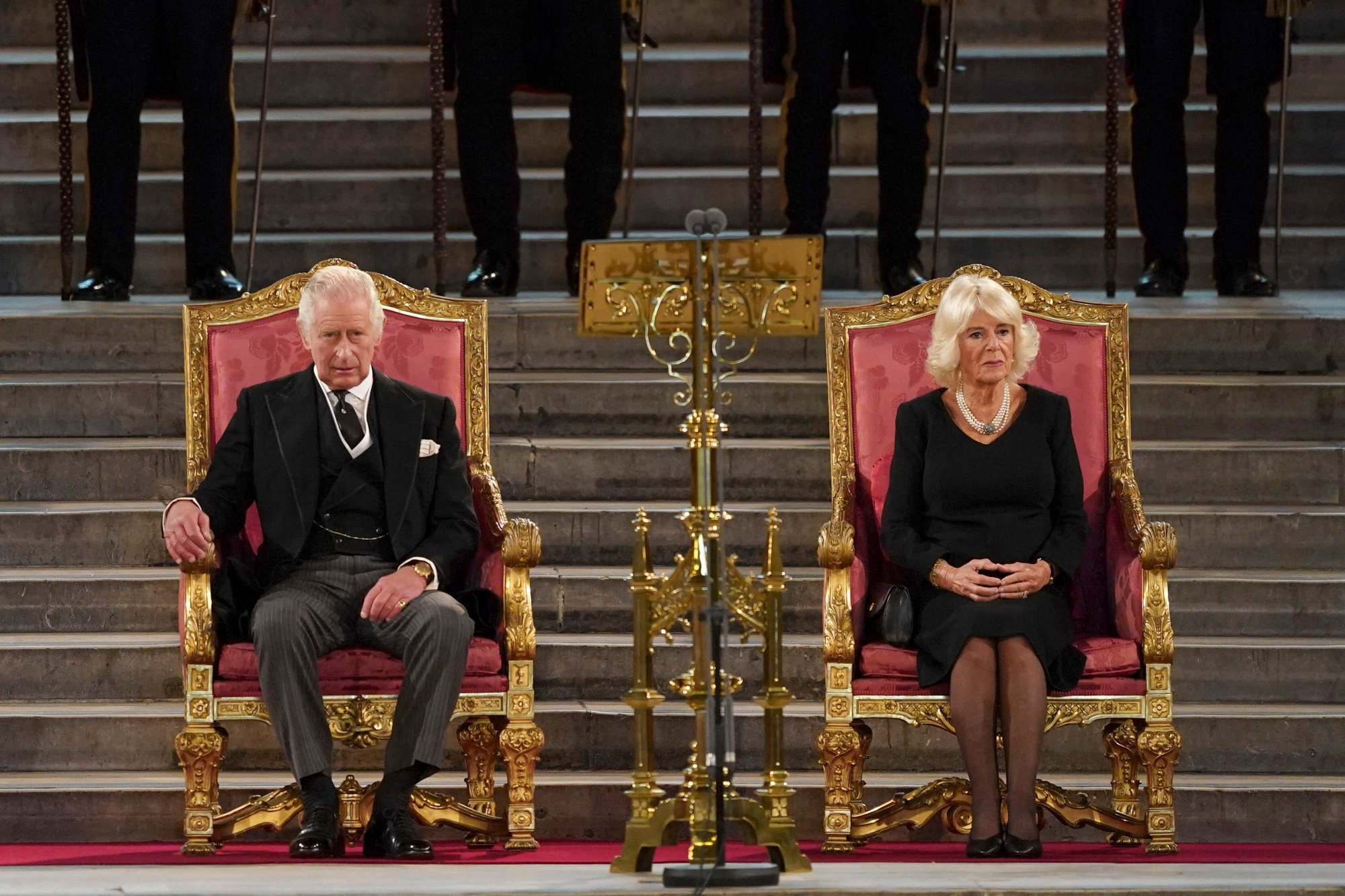 Britain’s King Charles, left, and Camilla, the queen consort, sit at Westminster Hall, where both Houses of Parliament are meeting to express their condolences following the death of Queen Elizabeth, at Westminster Hall, in London, on September 12. Photo: AP