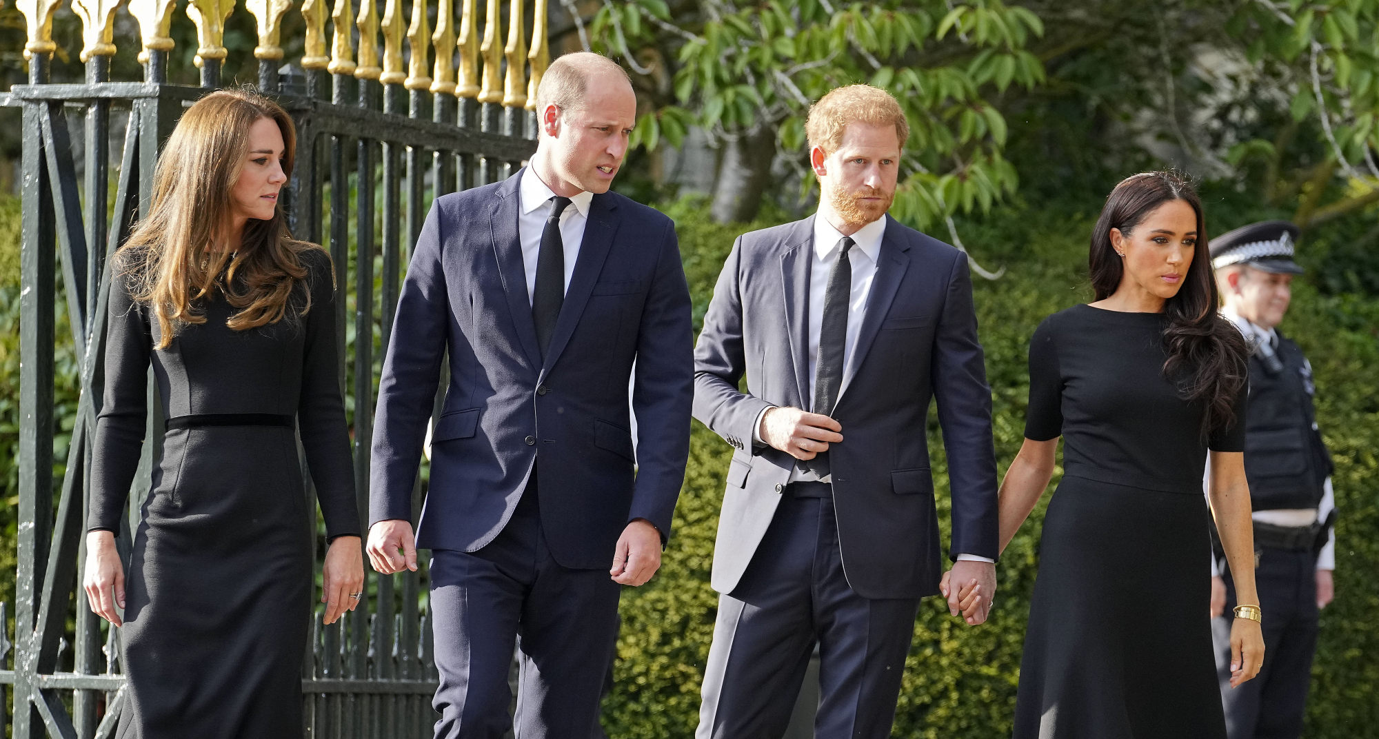 Britain’s Prince William and Kate, Princess of Wales and Britain’s Prince Harry and Meghan, Duchess of Sussex leave the gate to view the floral tributes for the late Queen Elizabeth outside Windsor Castle, in Windsor, England, on September 10. Photo: AP Photo