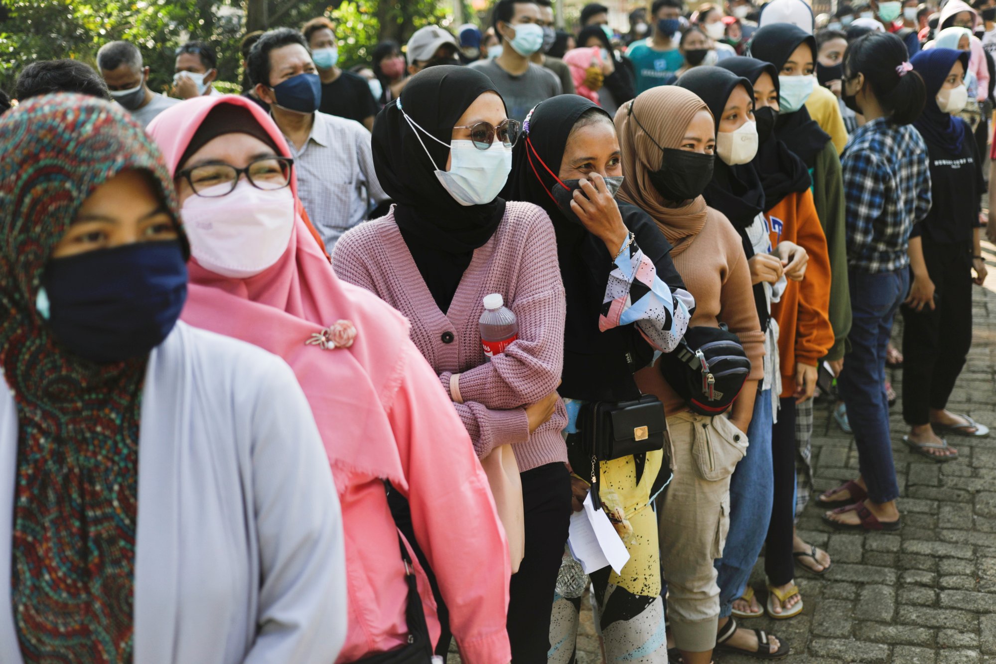 Women in Jakarta, Indonesia, queue to receive Covid-19 vaccine shots in 2021. Photo: Reuters