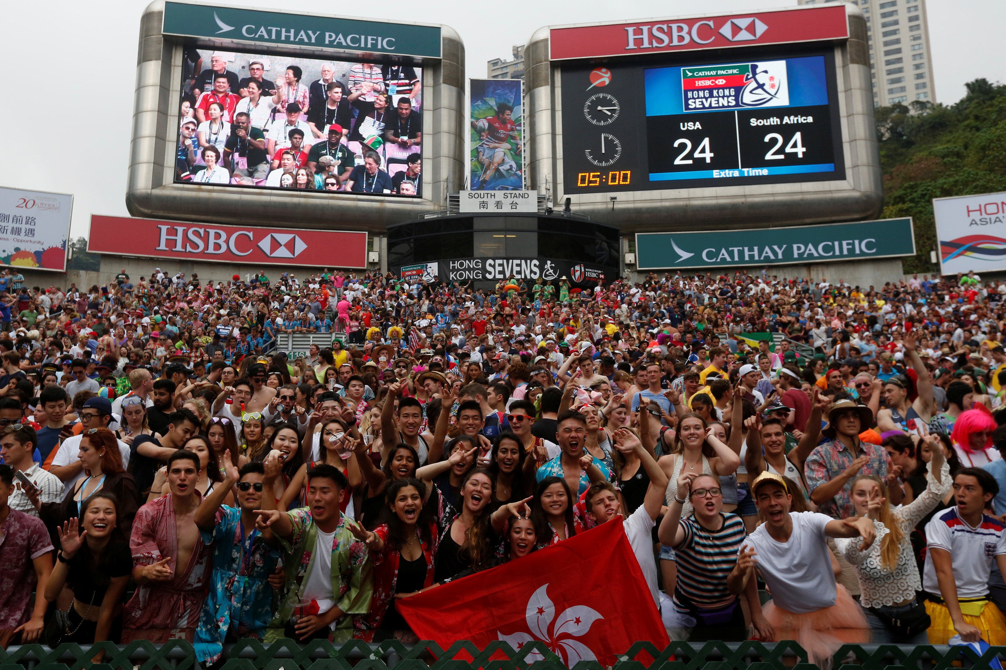 Hong Kong Sevens rugby fans in the south stand of the Hong Kong Stadium on April 9, 2017. The coming Sevens event is a chance to remind the world that Hong Kong still remembers how to throw a party. Photo: Reuters