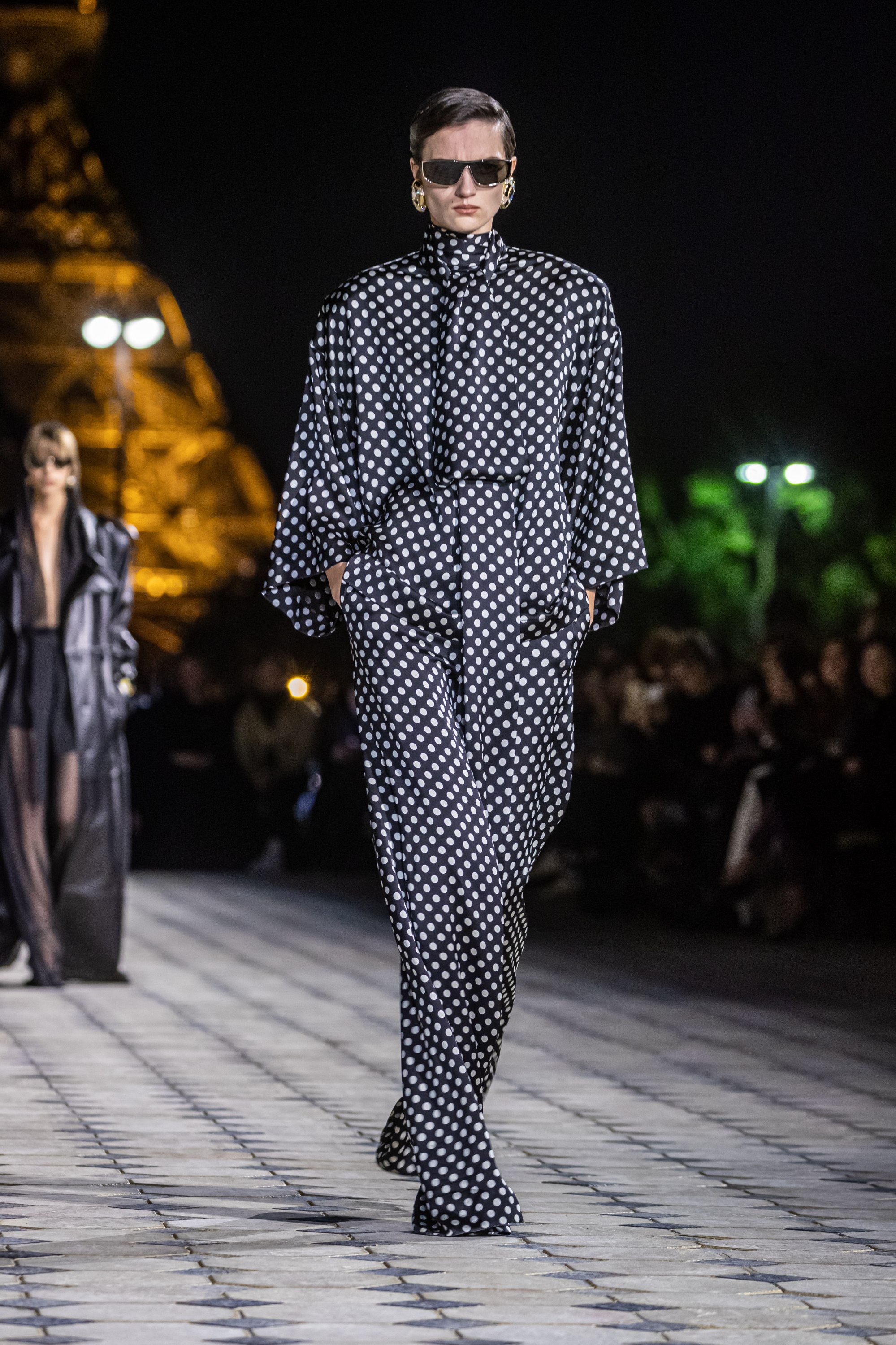 Yves Saint Laurent sends silky evening gowns down Eiffel Tower runway