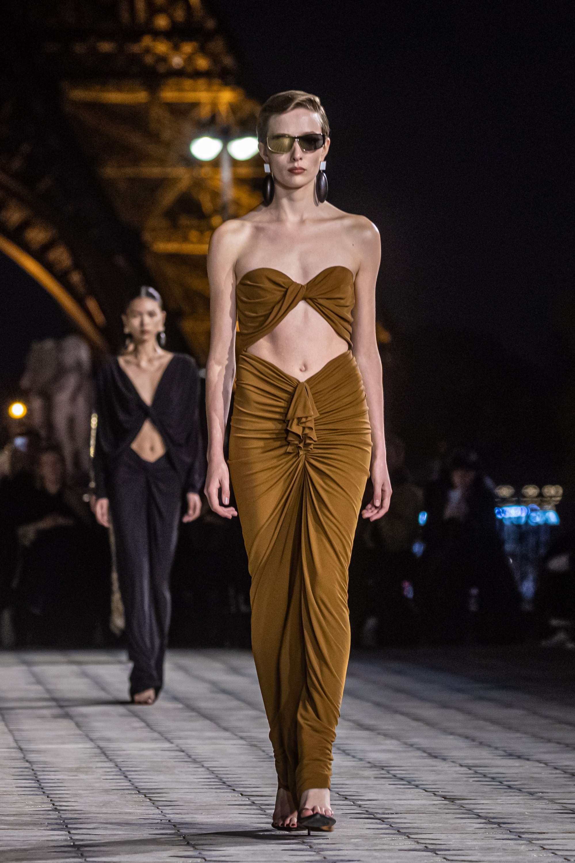 Yves Saint Laurent sends silky evening gowns down Eiffel Tower runway