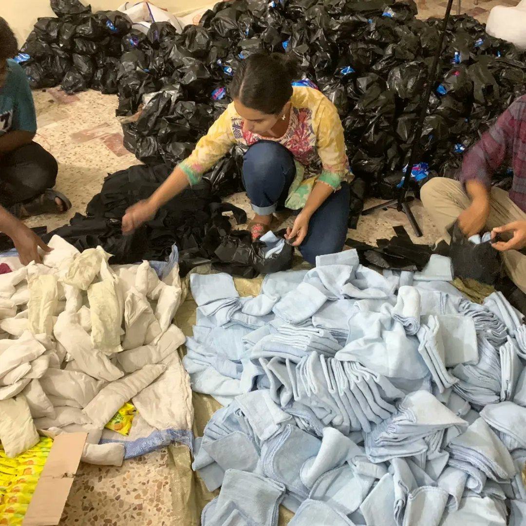 Student Bushra Mahnoor packs supplies for menstruating women and girls caught up in Pakistan’s floods. Menstruation is a taboo topic in the country. Photo: Mahwari Justice