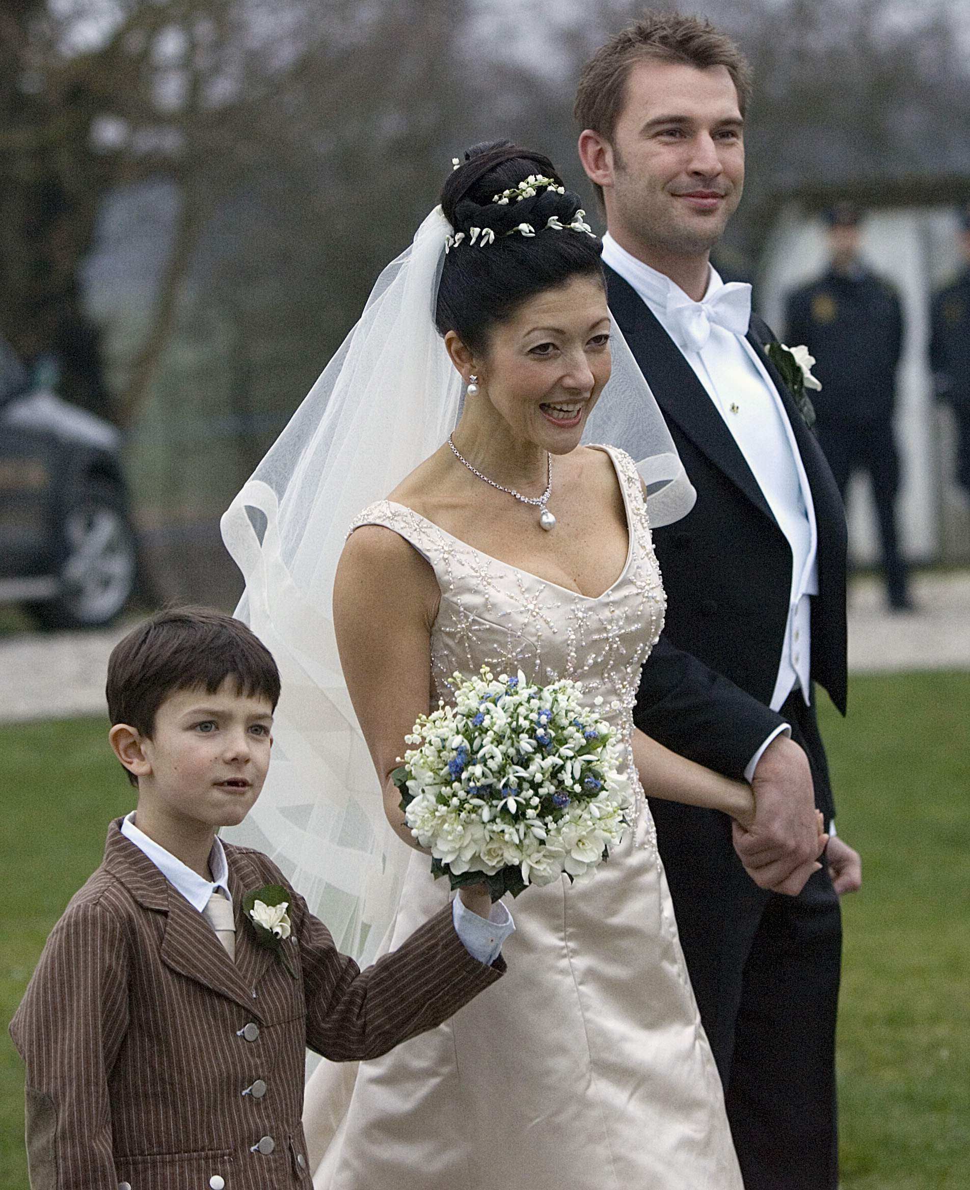 Former Danish Princess Alexandra (centre) walks with her son Prince Nikolai (left) and photographer Martin Jorgensen (right) after her wedding at Oester Egede Church, in 2007. Photo: Reuters