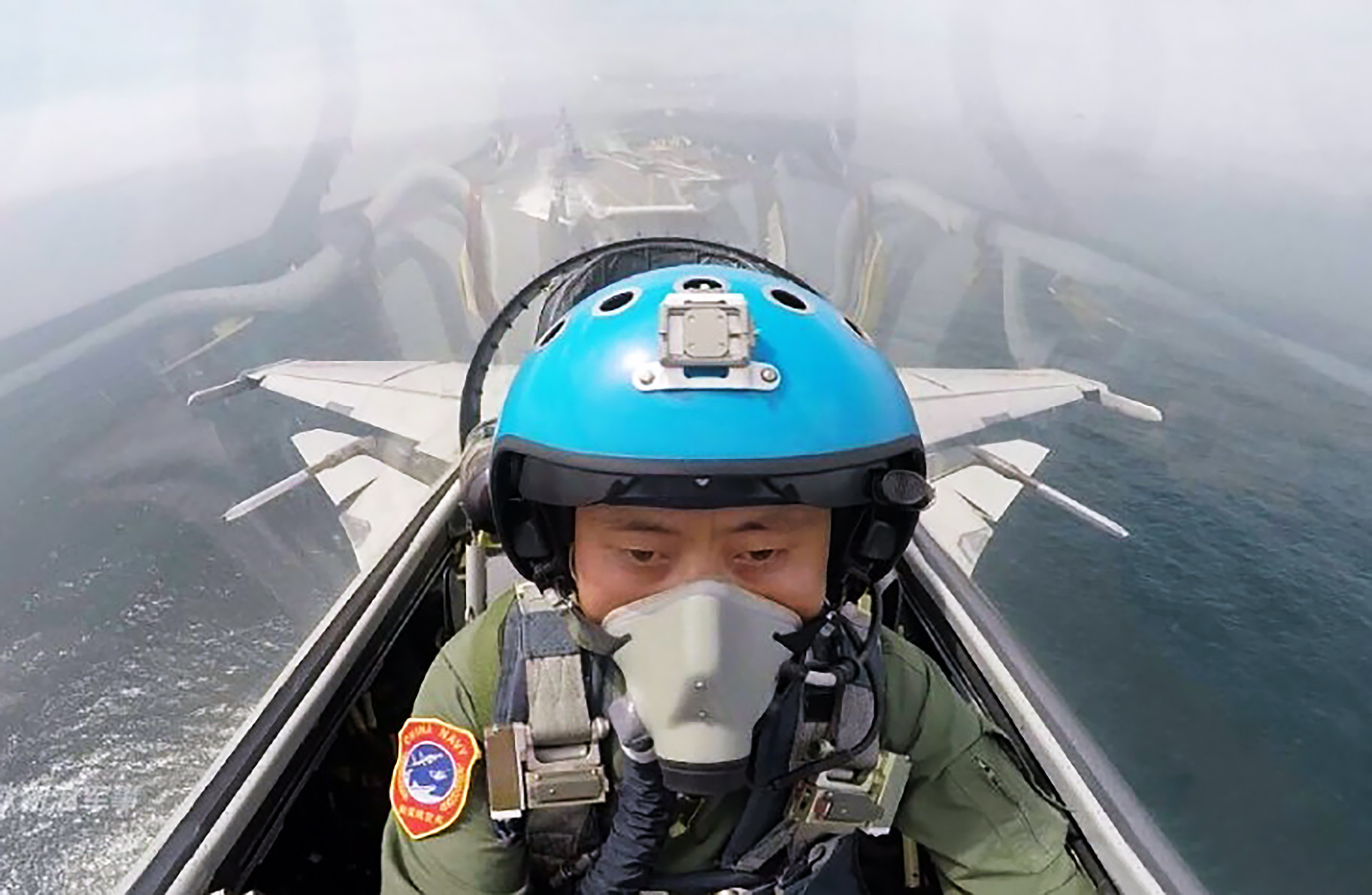 A PLA Navy pilot in a J-15 takes to the skies after leaving the deck of the aircraft carrier Liaoning. Photo: Handout