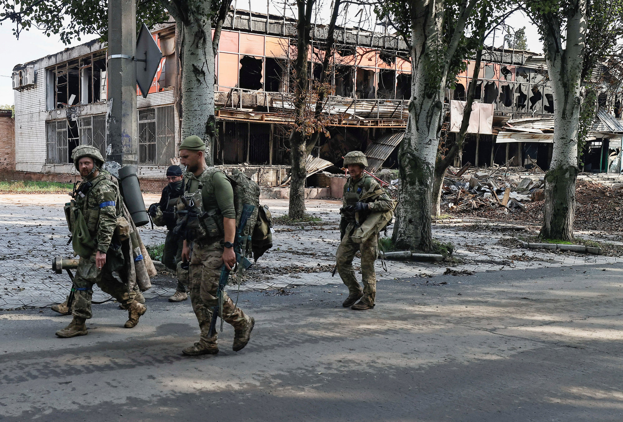 Ukrainian soldiers walk in Bakhmut, amid Russia’s attack on Ukraine on Saturday. Photo: Reuters