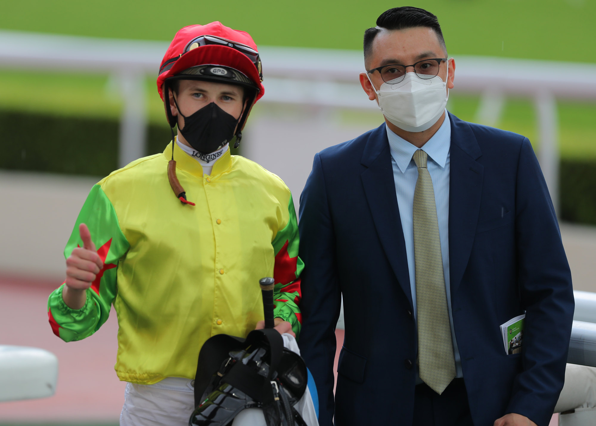 Jockey Luke Ferraris and trainer Pierre Ng after Happy Sharing’s win.