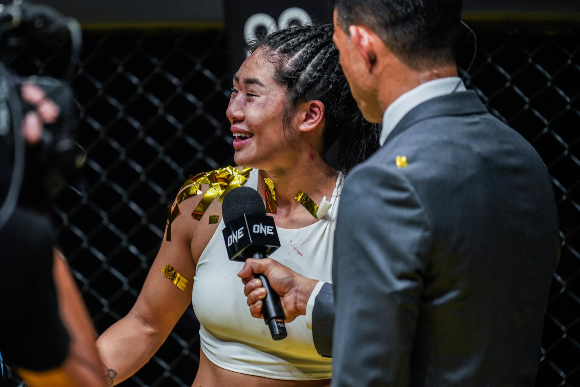 Angela Lee gives a post fight interview after losing to Xiong Jingnan in Singapore.