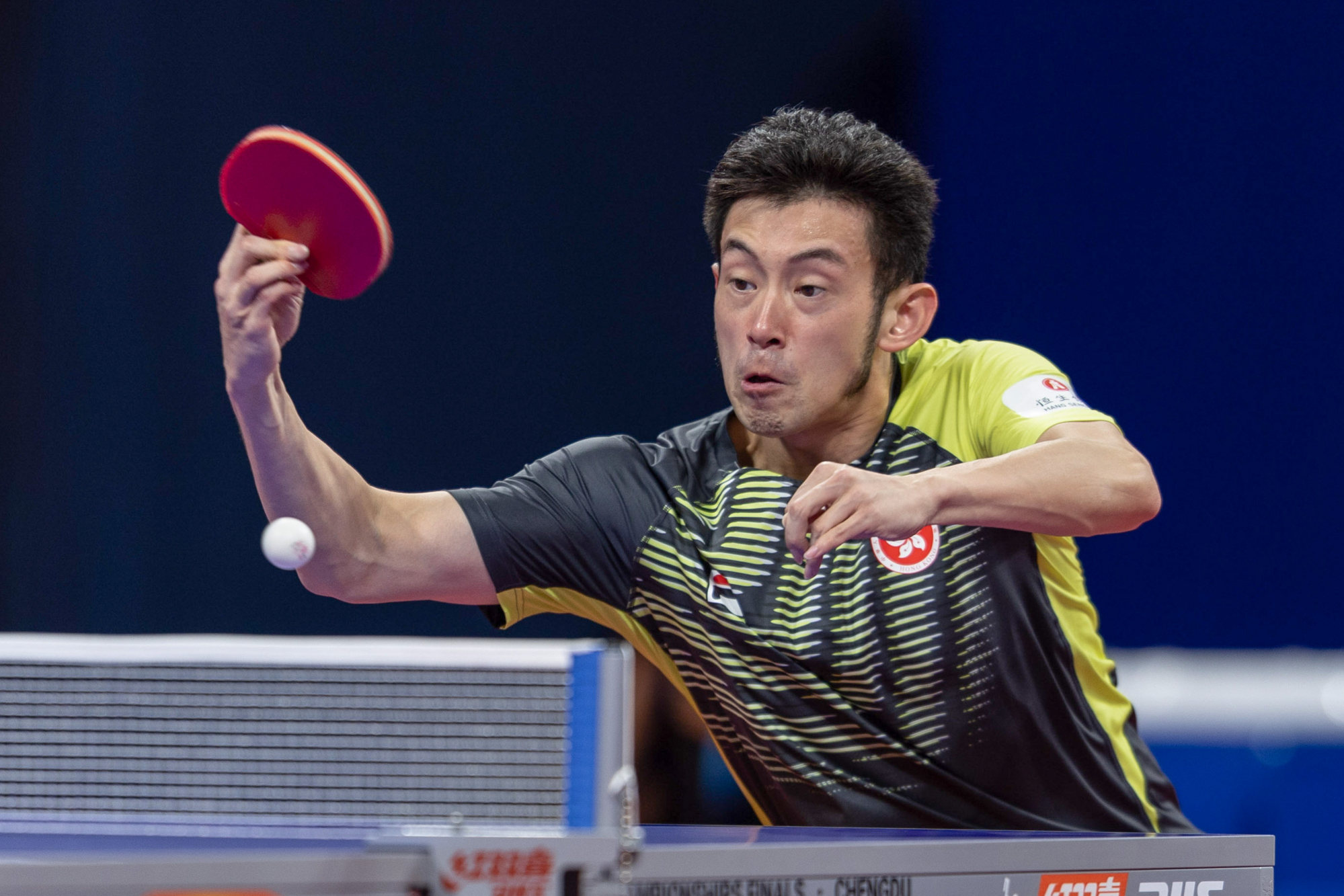 Wong Chun-ting hits a return to Harimoto Tomokazu of Japan. Photo: Xinhua