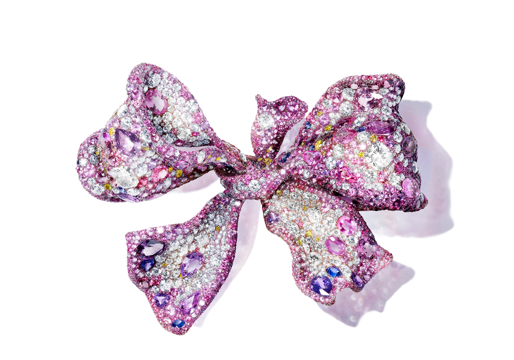 The Rosé Ribbon brooch from the Black Label Masterpiece VI collection is set with diamonds and 10 different gemstones, including fancy-cut pink and purple sapphires, rubies and garnets.
