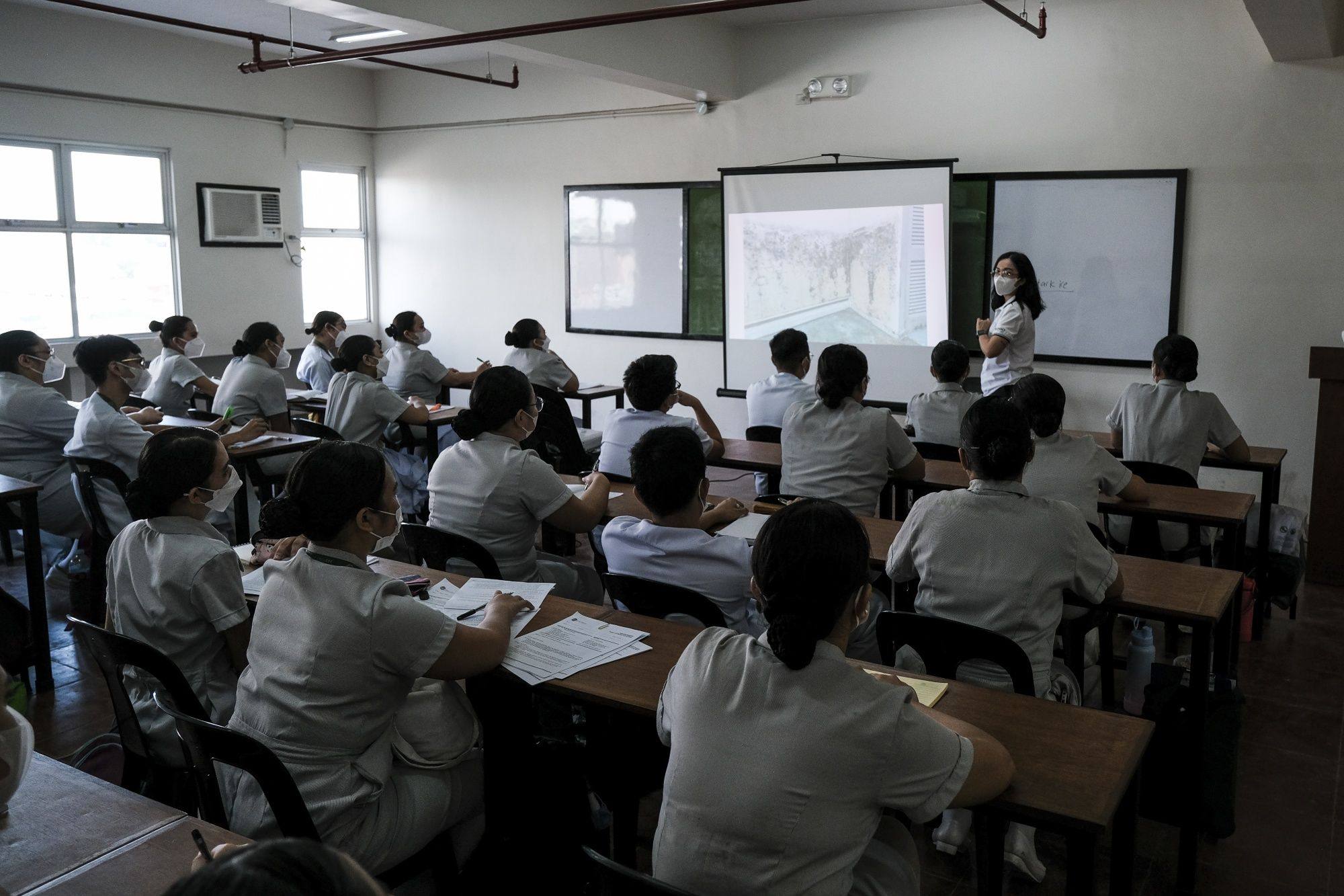 Student nurses attend a lecture in a classroom at Phinma Corp.’s St Jude College in Manila, the Philippines. Photo: Bloomberg